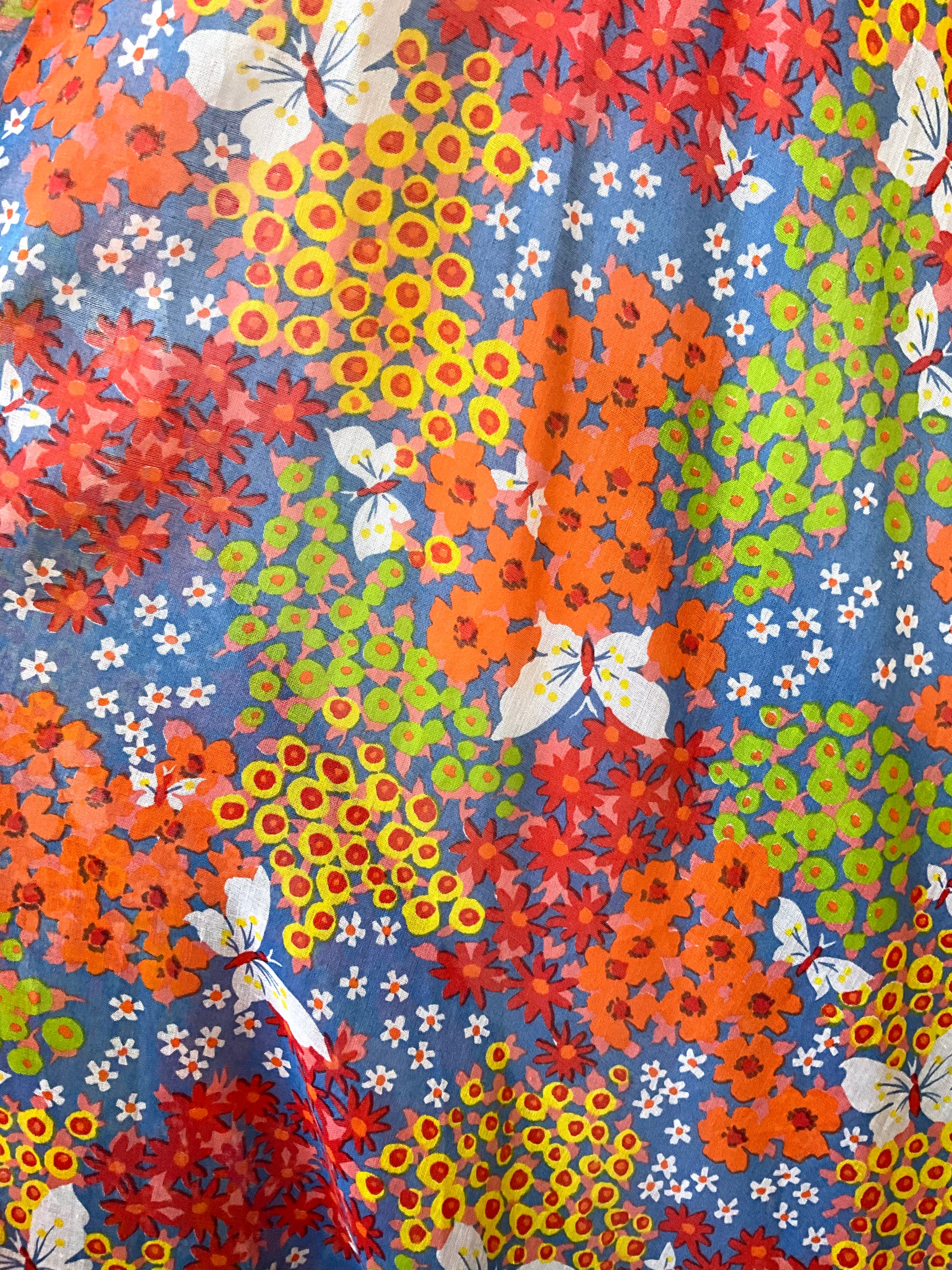 Colorful floral and butterfly pattern on a blue background