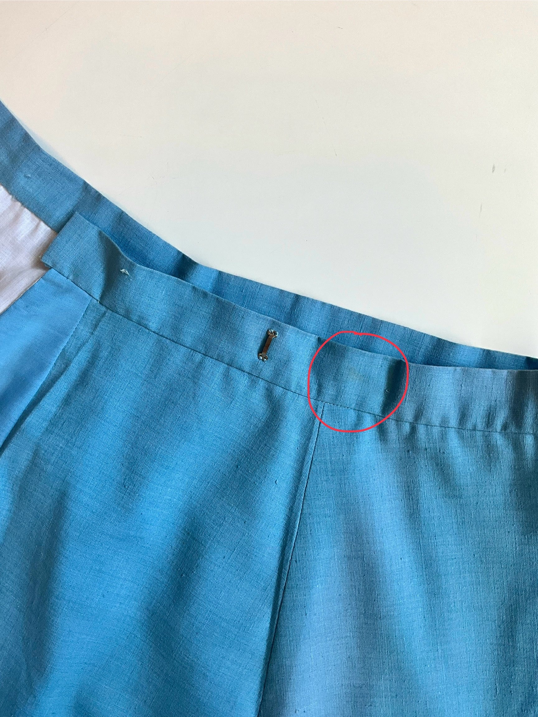 Close-up of a blue skirt on a white background