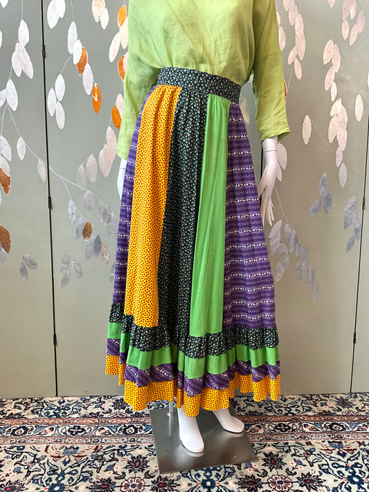 Mannequin wearing a colorful skirt with a patterned background