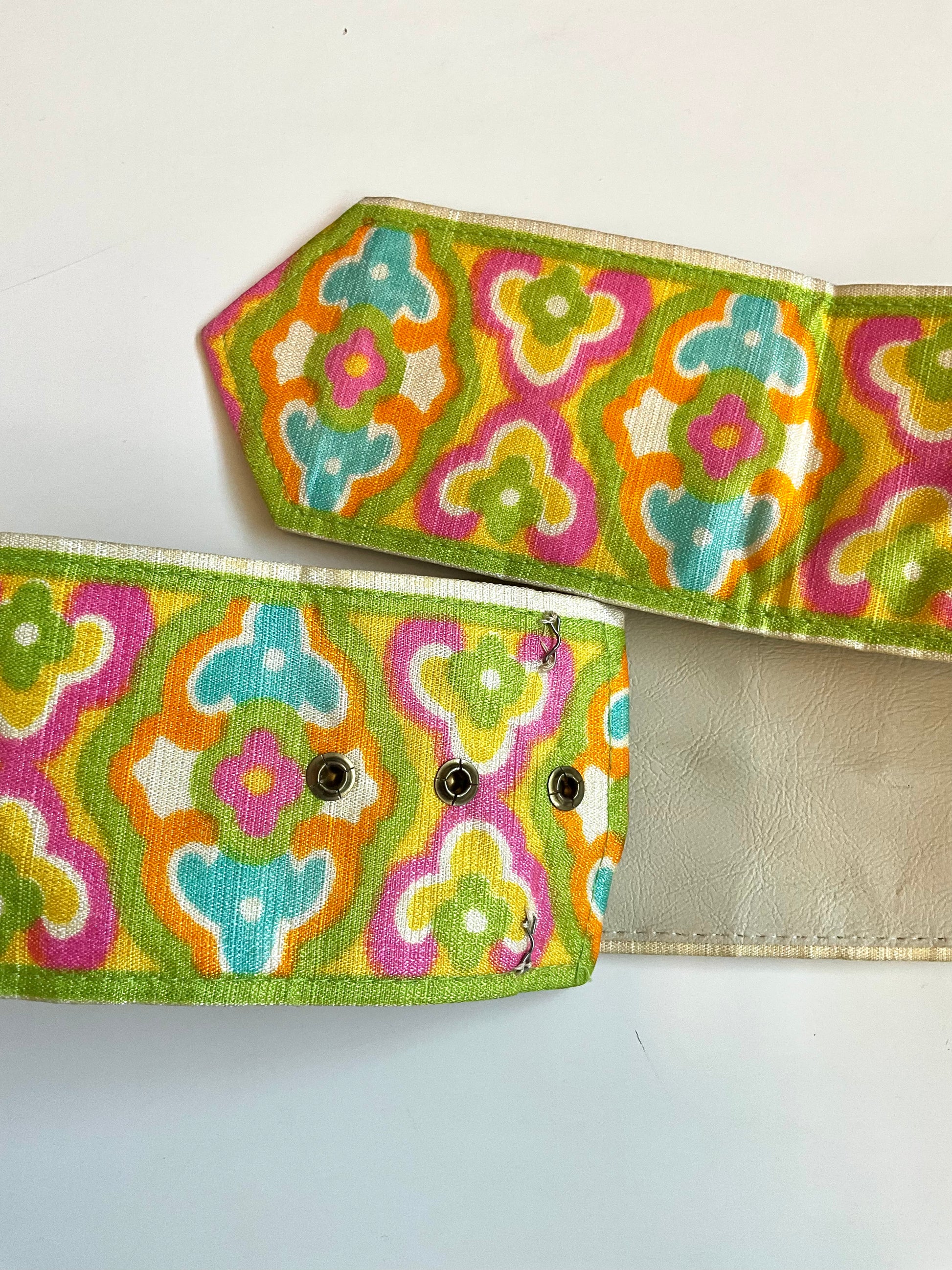 Colorful patterned belt with a plain background