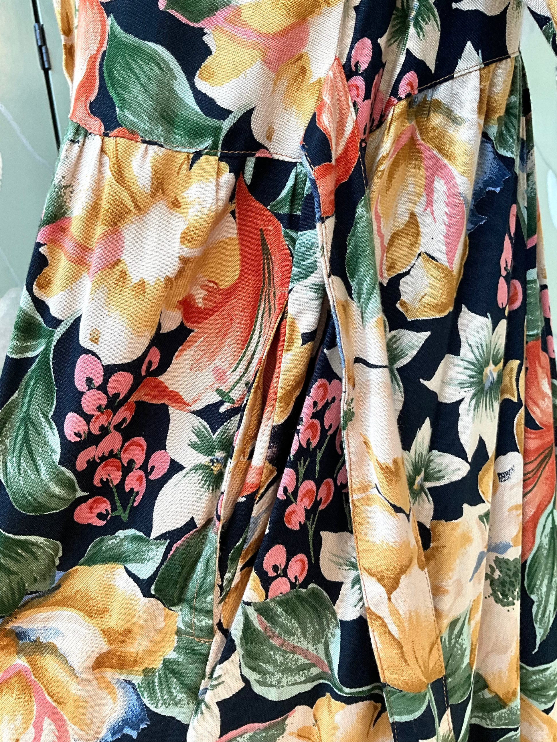 Close-up of a pocket detail on a colourful floral dress 