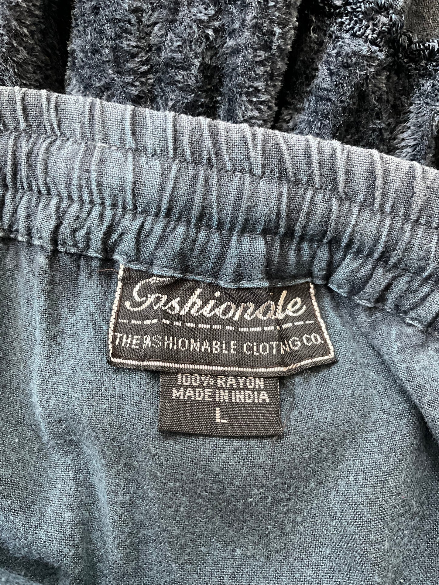 Close-up of a label on a garment with 'Fashionable' branding.