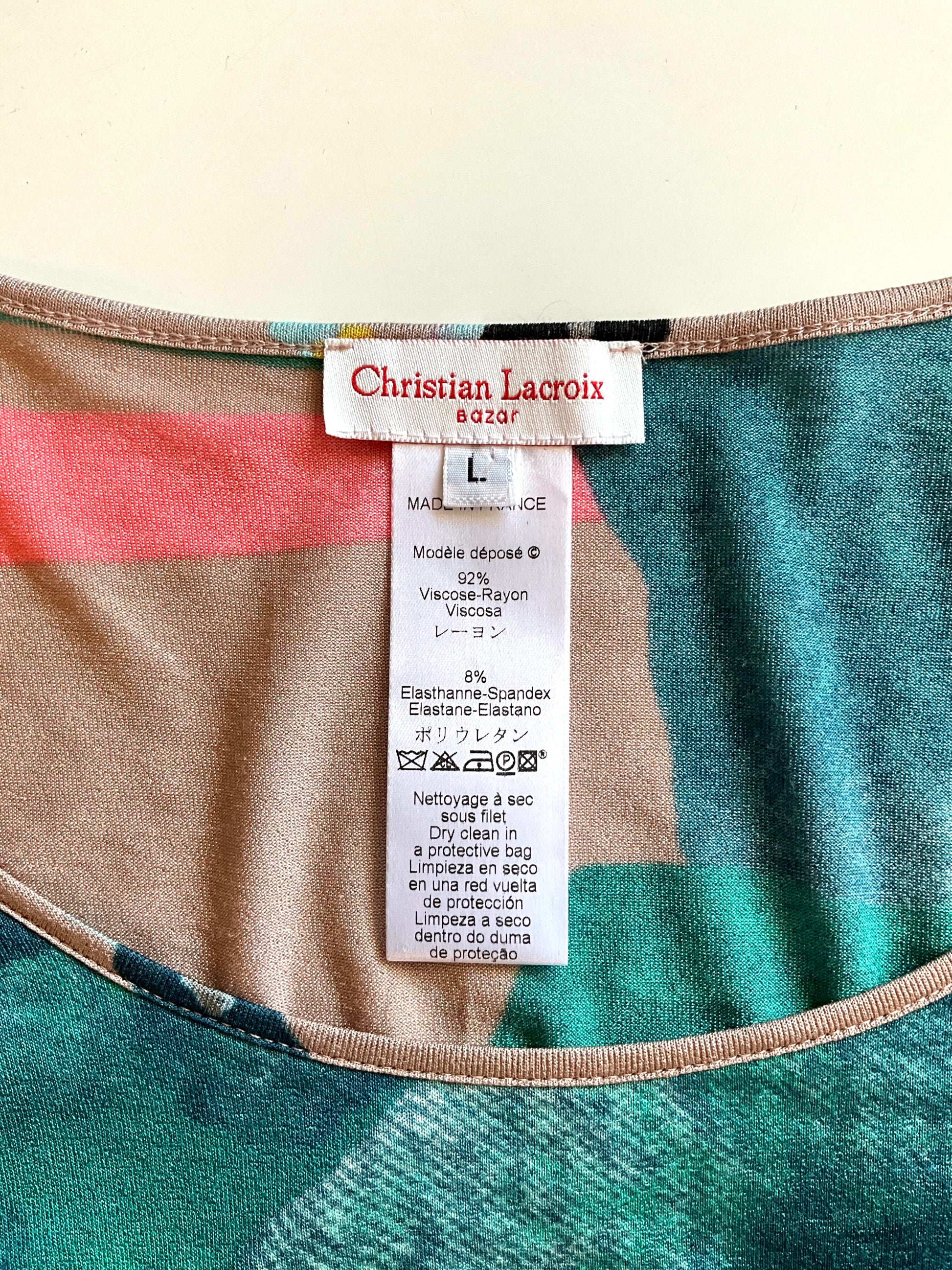 Close-up of a Christian Lacroix label on a garment with a multicolored pattern.