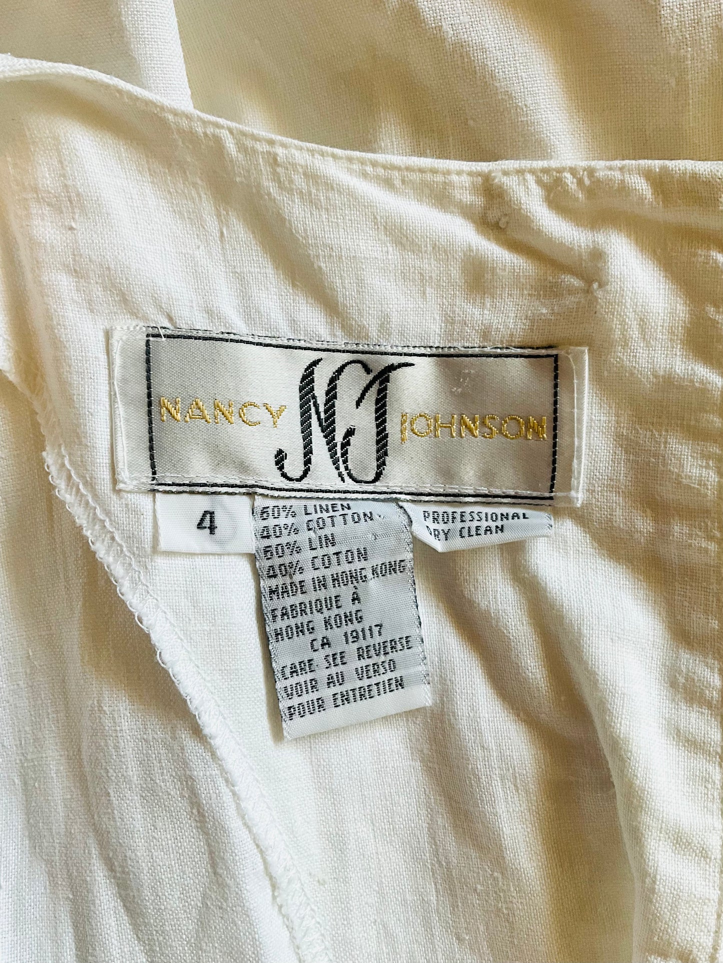 Nancy Johnson label on a white fabric background