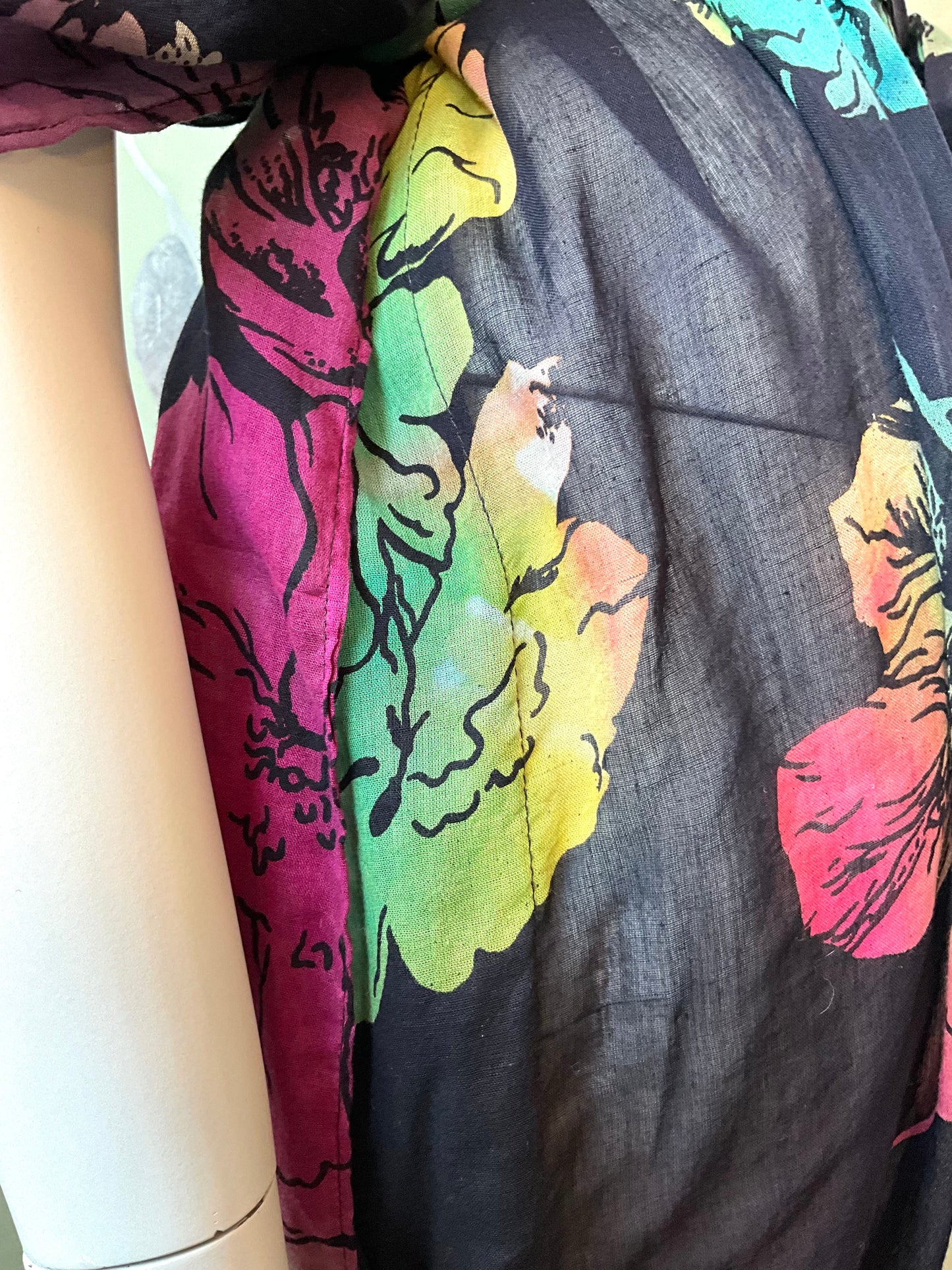 Close-up of colorful dress detail on a mannequin.