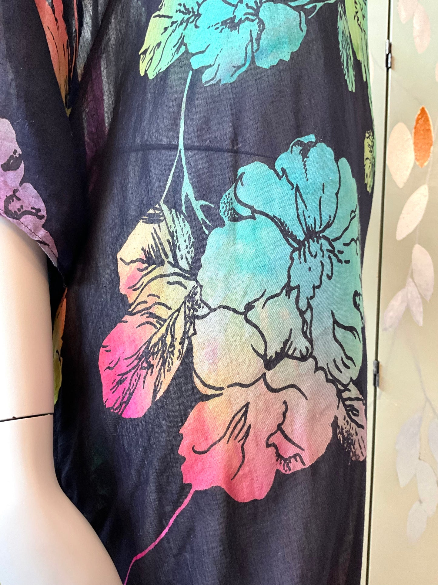 Colorful floral dress print on a black cotton background