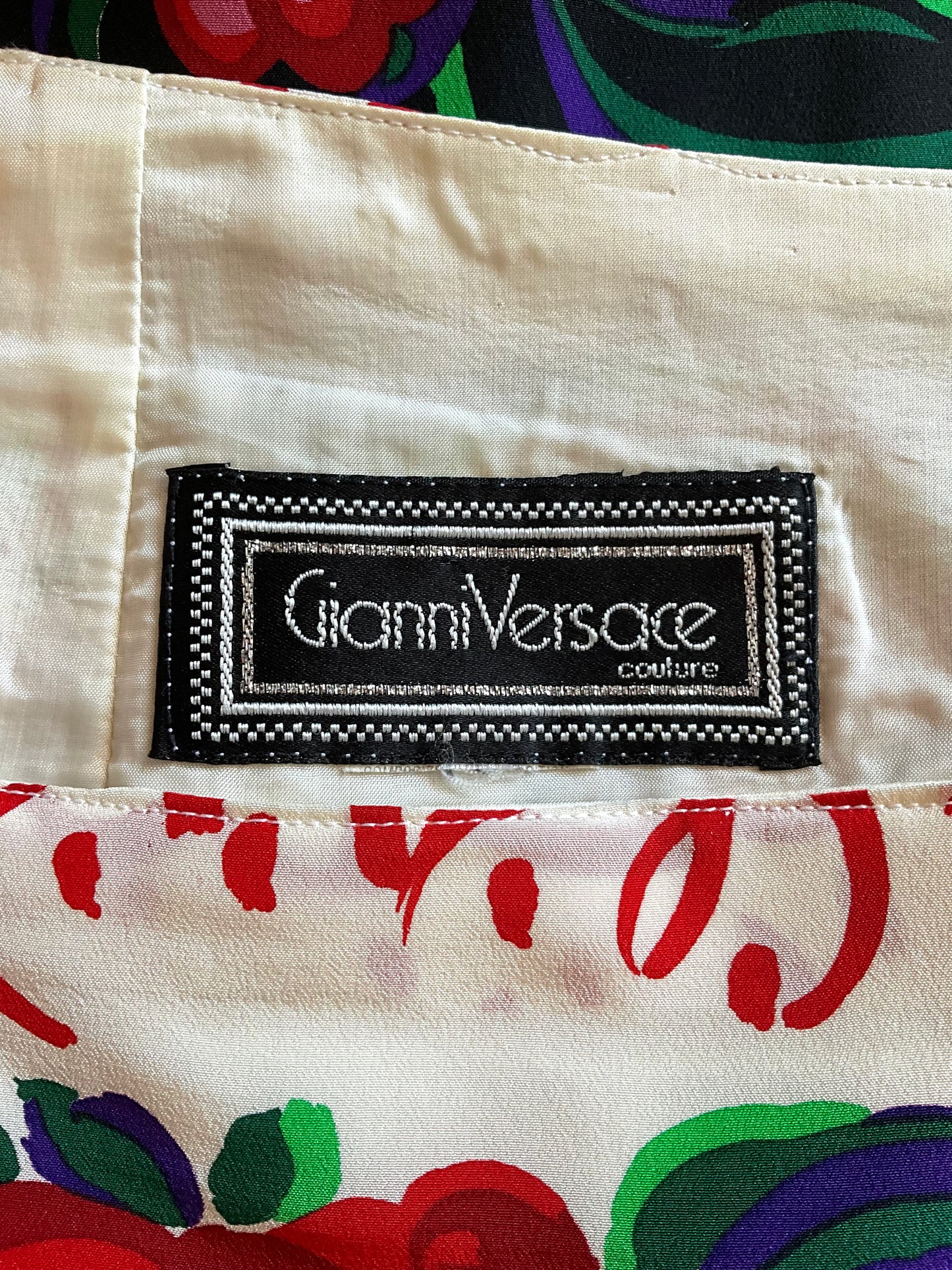 Gianni Versace label on a garment with colorful pattern
