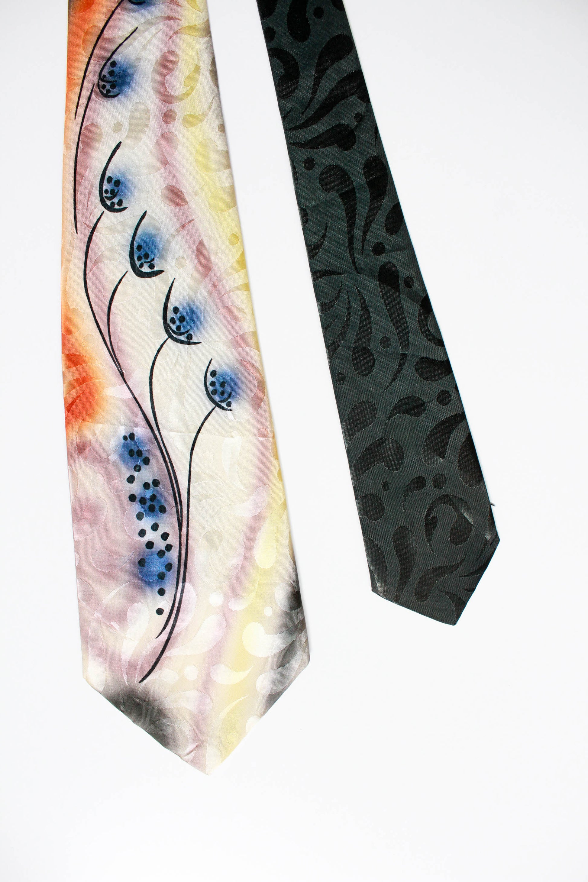 1940s abstract print hand painted rayon jacquard necktie with a wide tongue, mauve, orange, blue, yellow, dark green