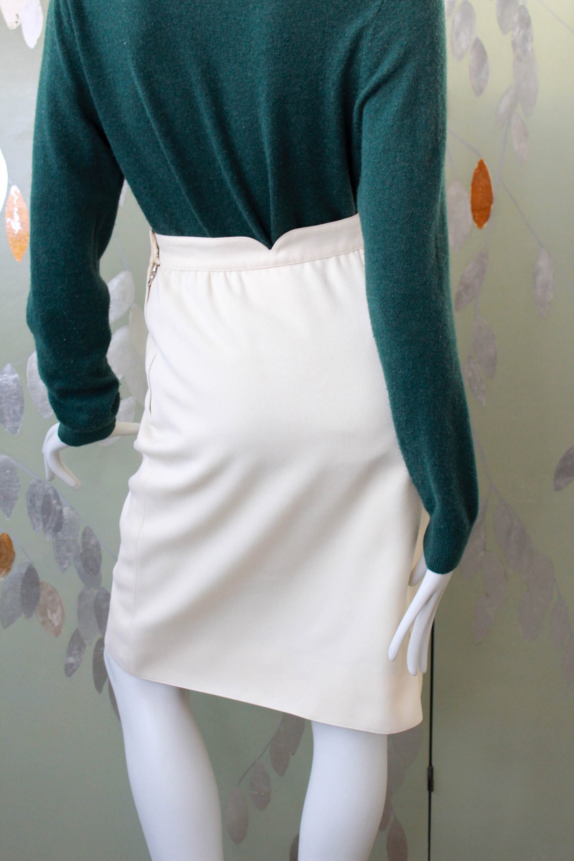 vintage courrèges cream wool pencil skirt with front flapped pockets, curved waistband with V cut out, mod 1960s style designer skirt made in france