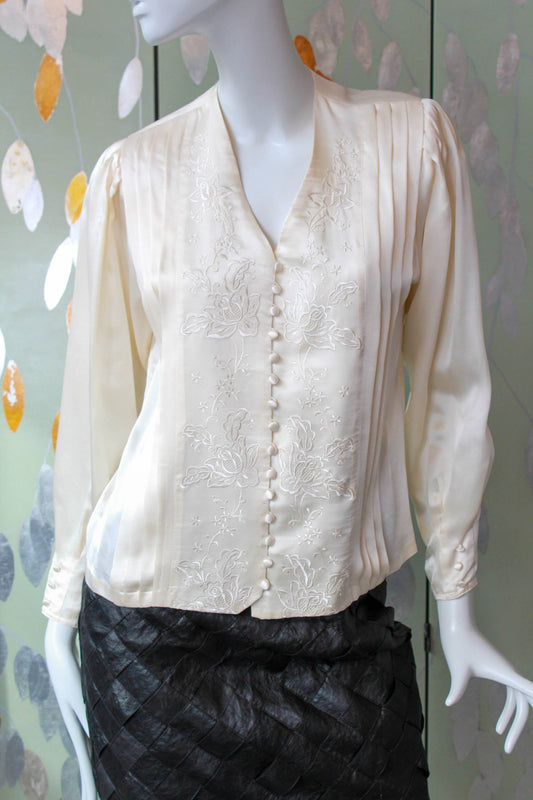 romantic liquid silk satin cream blouse with floral embroidered front, pleating detail, covered buttons and long puff sleeves. coquette aesthetic 