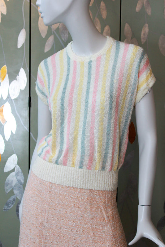 80s deadstock knit short sleeve top with vertical pink, yellow and green stripes against cream, ribbed hem