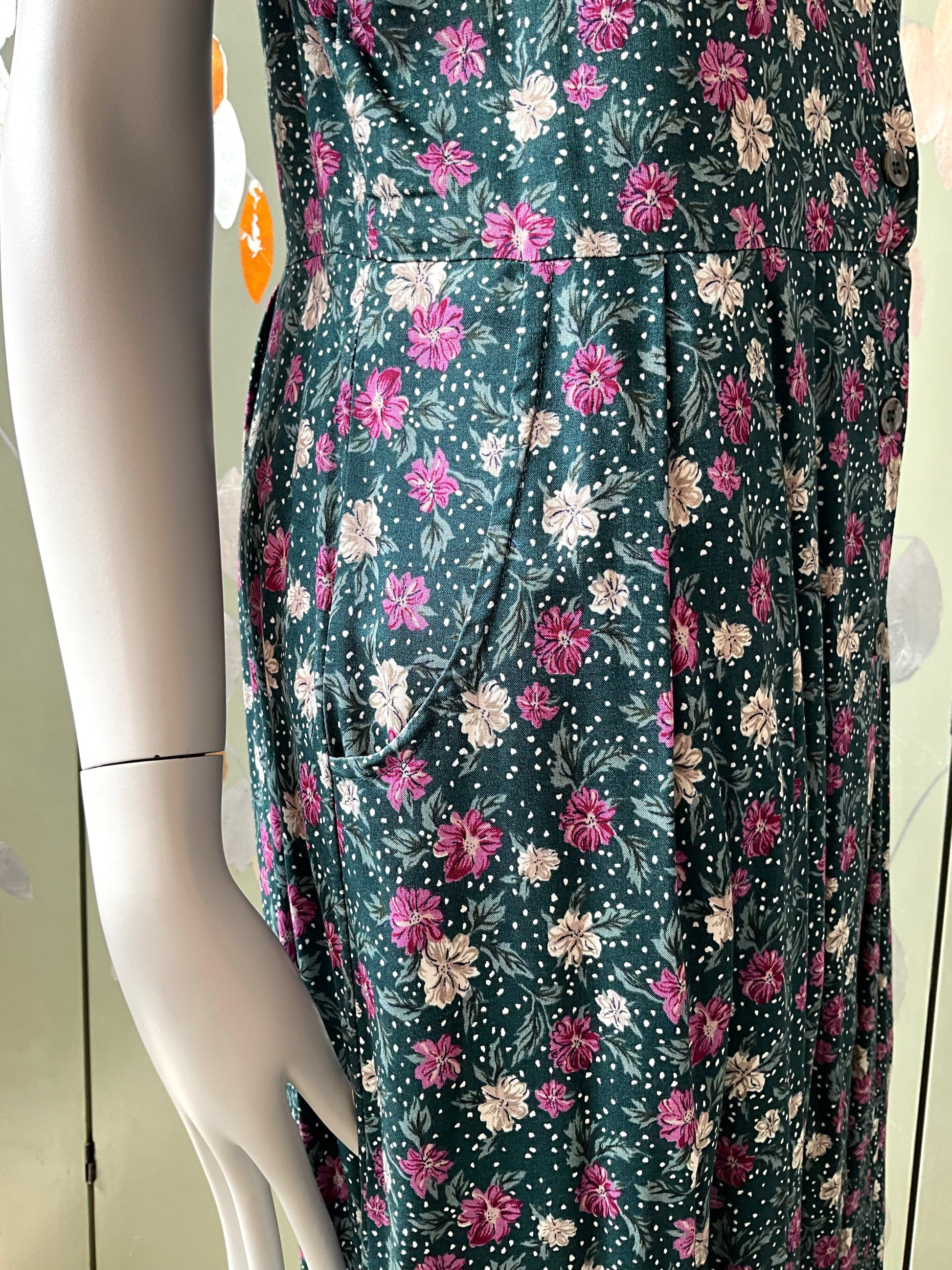 Floral dress on a mannequin with a light background
