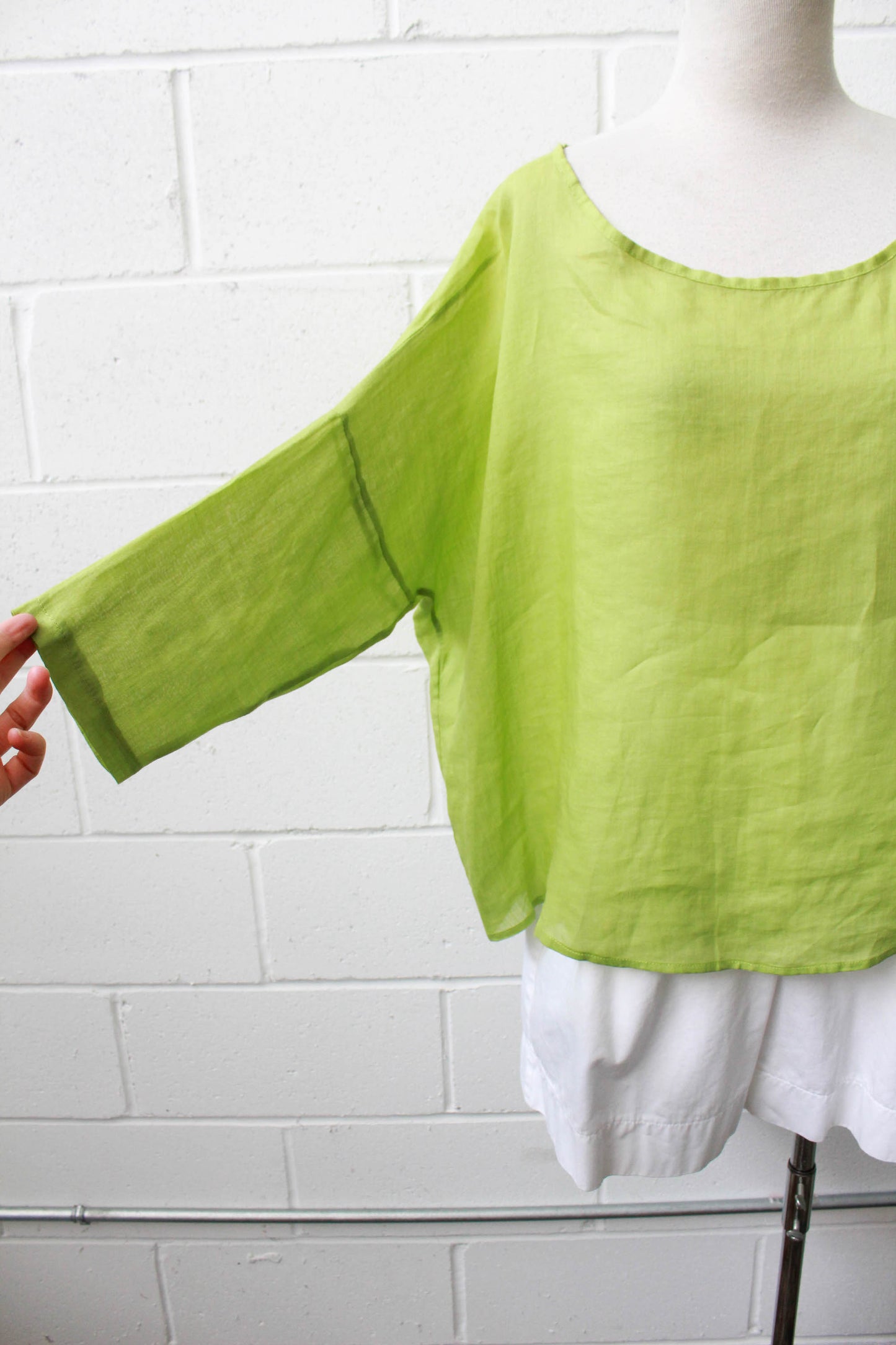 linen and silk green loose boxy cut blouse with scoop neck, three quarter sleeves 