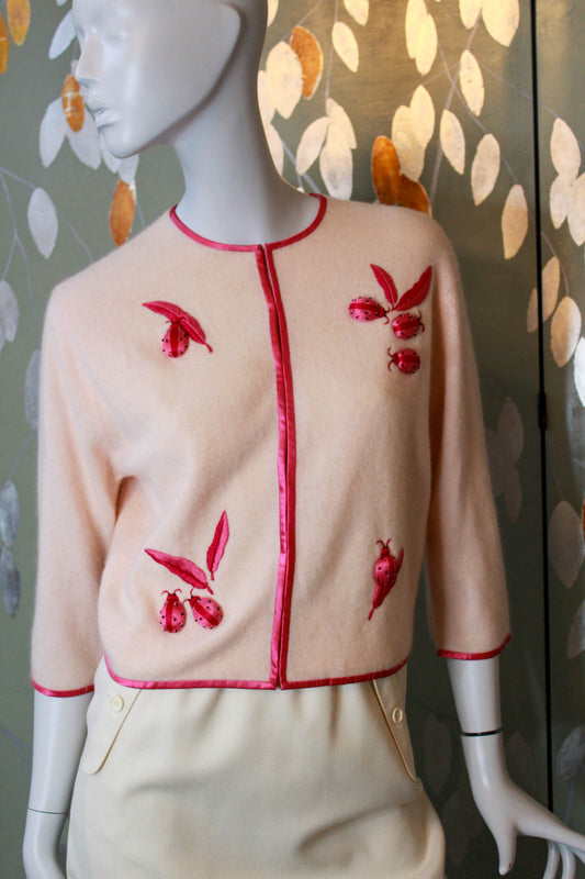 1950s lanvin cashmere pale peach pink cardigan with hot pink embroidered ladybugs and leaves, novelty vintage appliqued cardigan 
