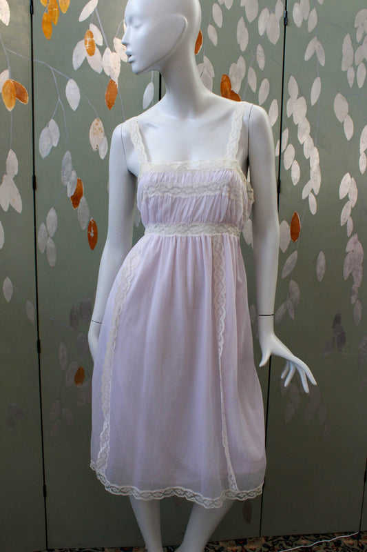 1960s pale lilac slip nightgown with lace straps and insets and trim, satin ribbon waist tie, coquette romantic aesthetic feminine vintage dressing gown