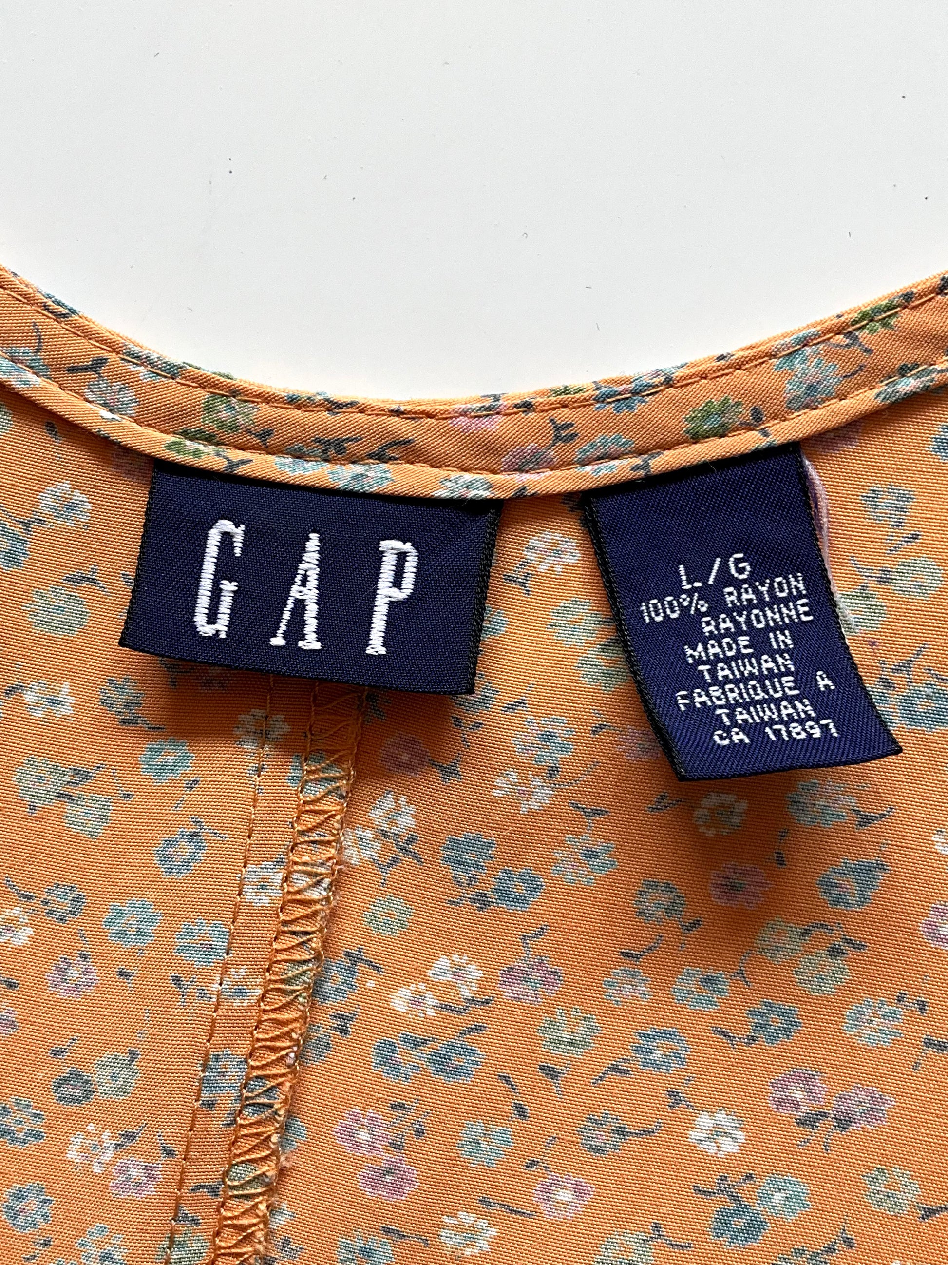 Close-up of a floral-patterned dress with a GAP label 