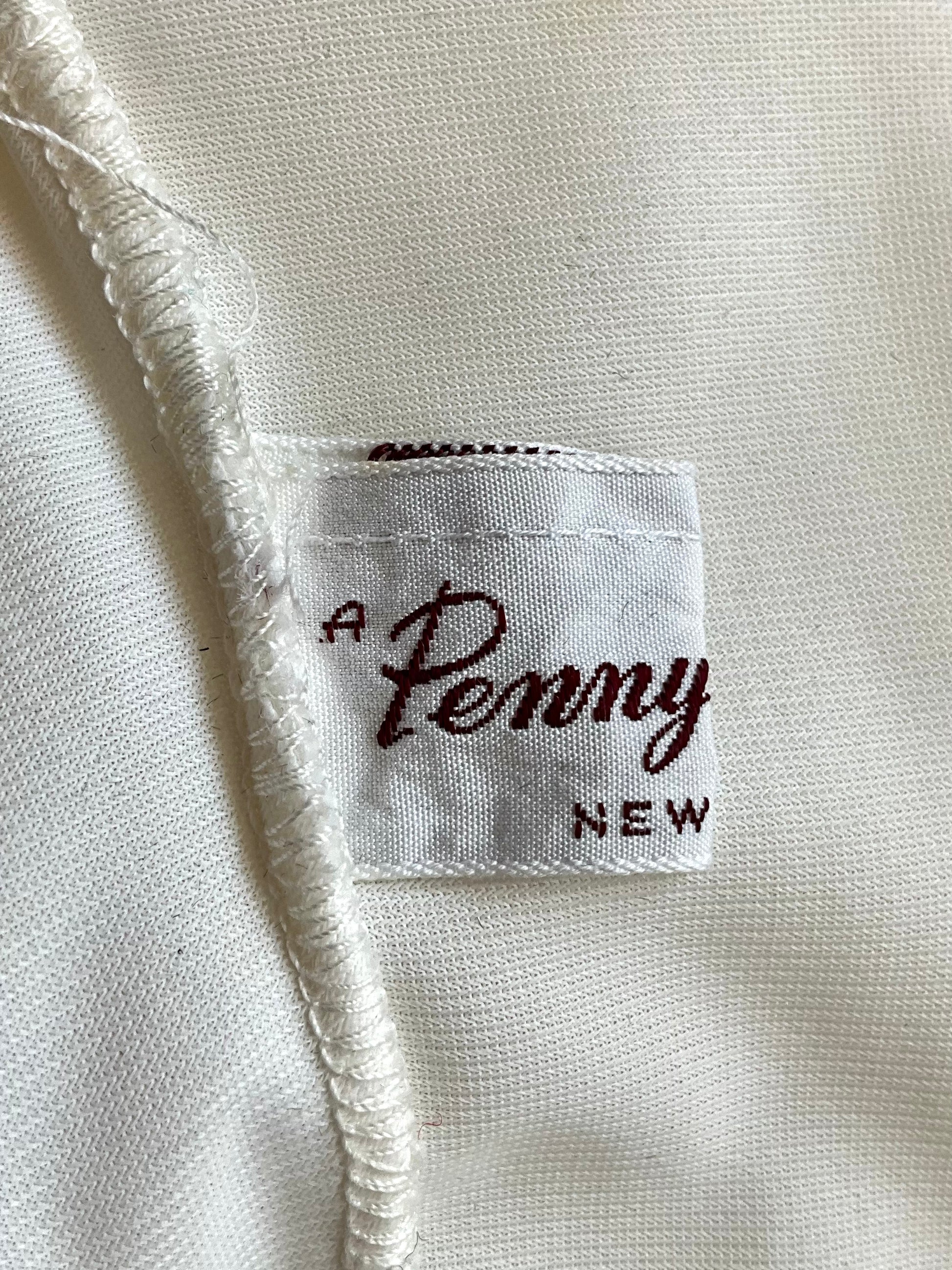 Close-up of a label on a white fabric background