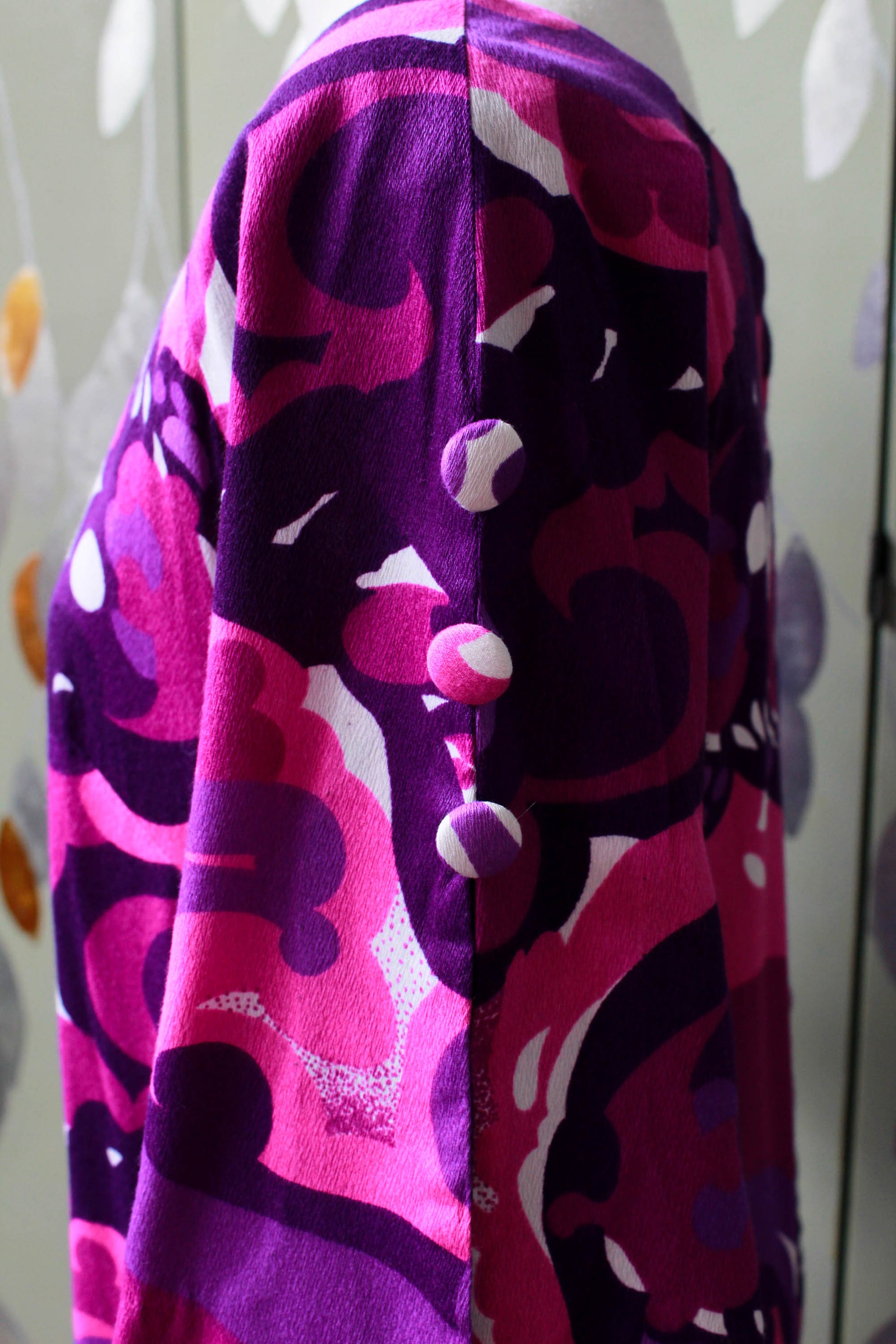 1970s purple abstract print maxi dress with flared elbow length sleeves, boat neck, buttons on sleeve