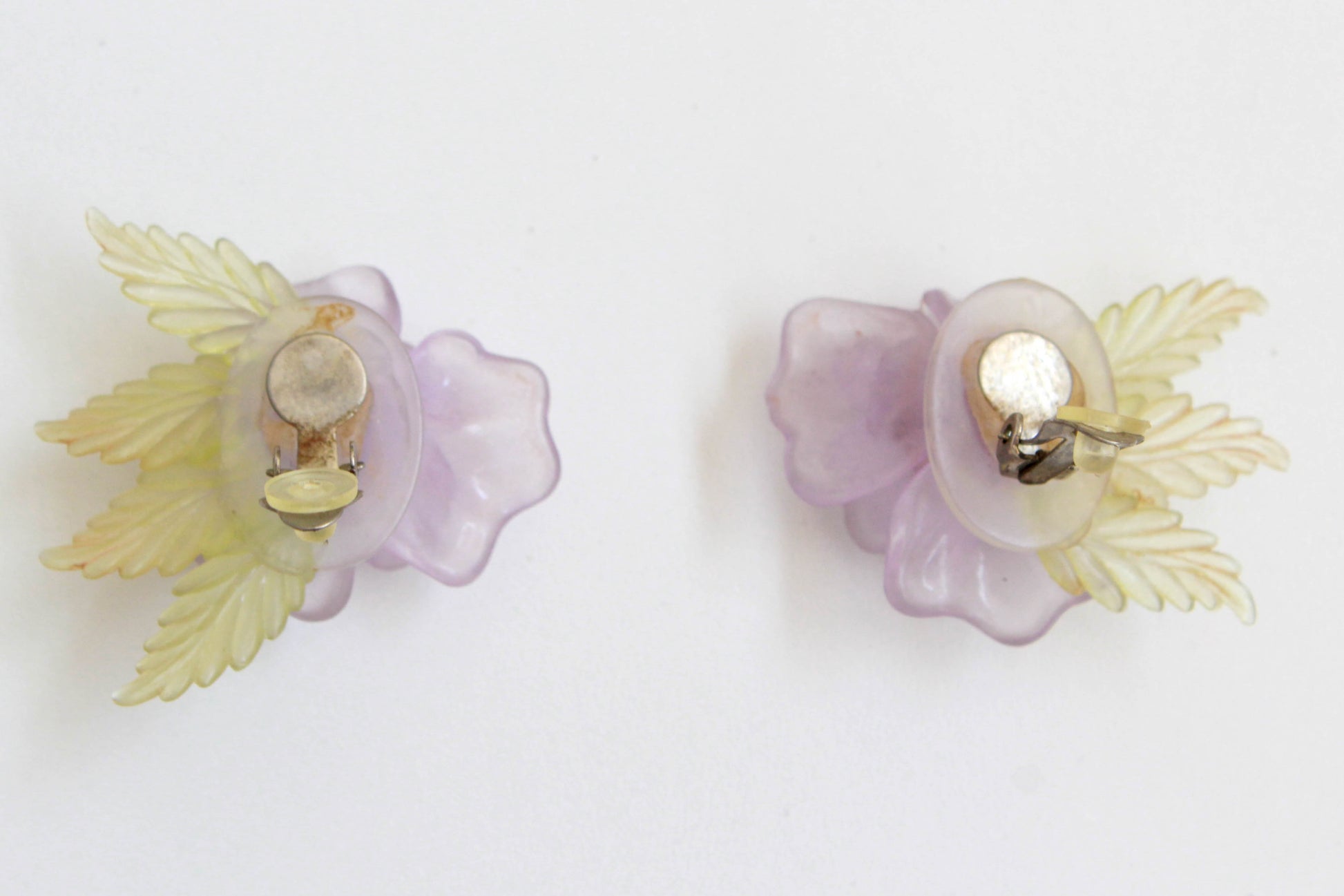 lilac plastic rose statement earrings, with translucent green leaves and rhinestone centres. vintage clip on earrings