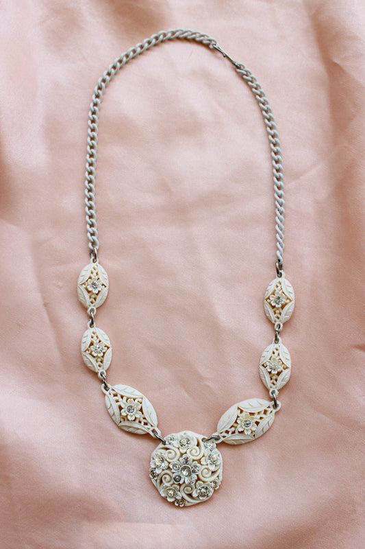 1950s White Carved Celluloid Rhinestone Necklace