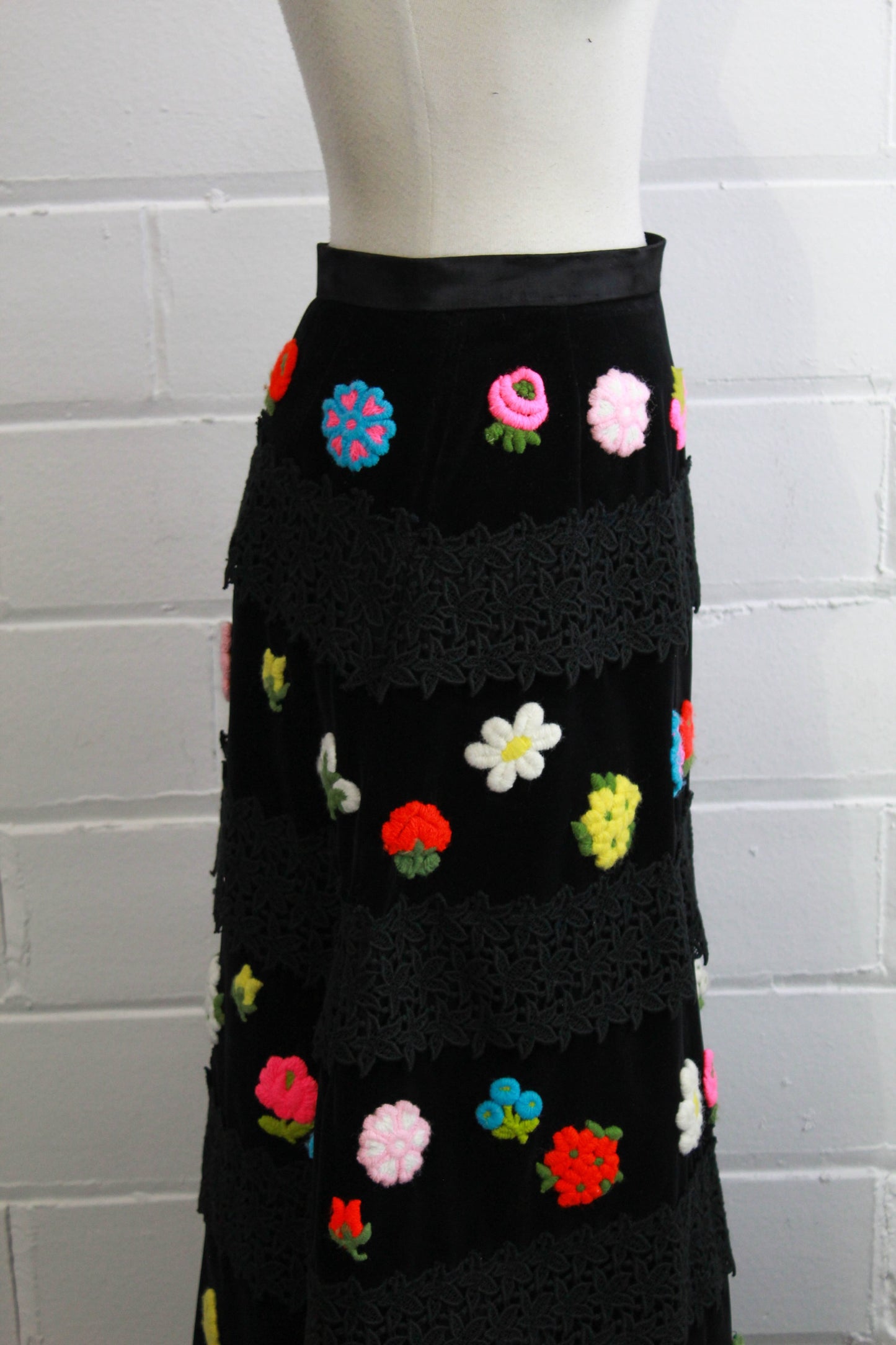 1970s floral applique maxi skirt black velvet with lace, side view close up