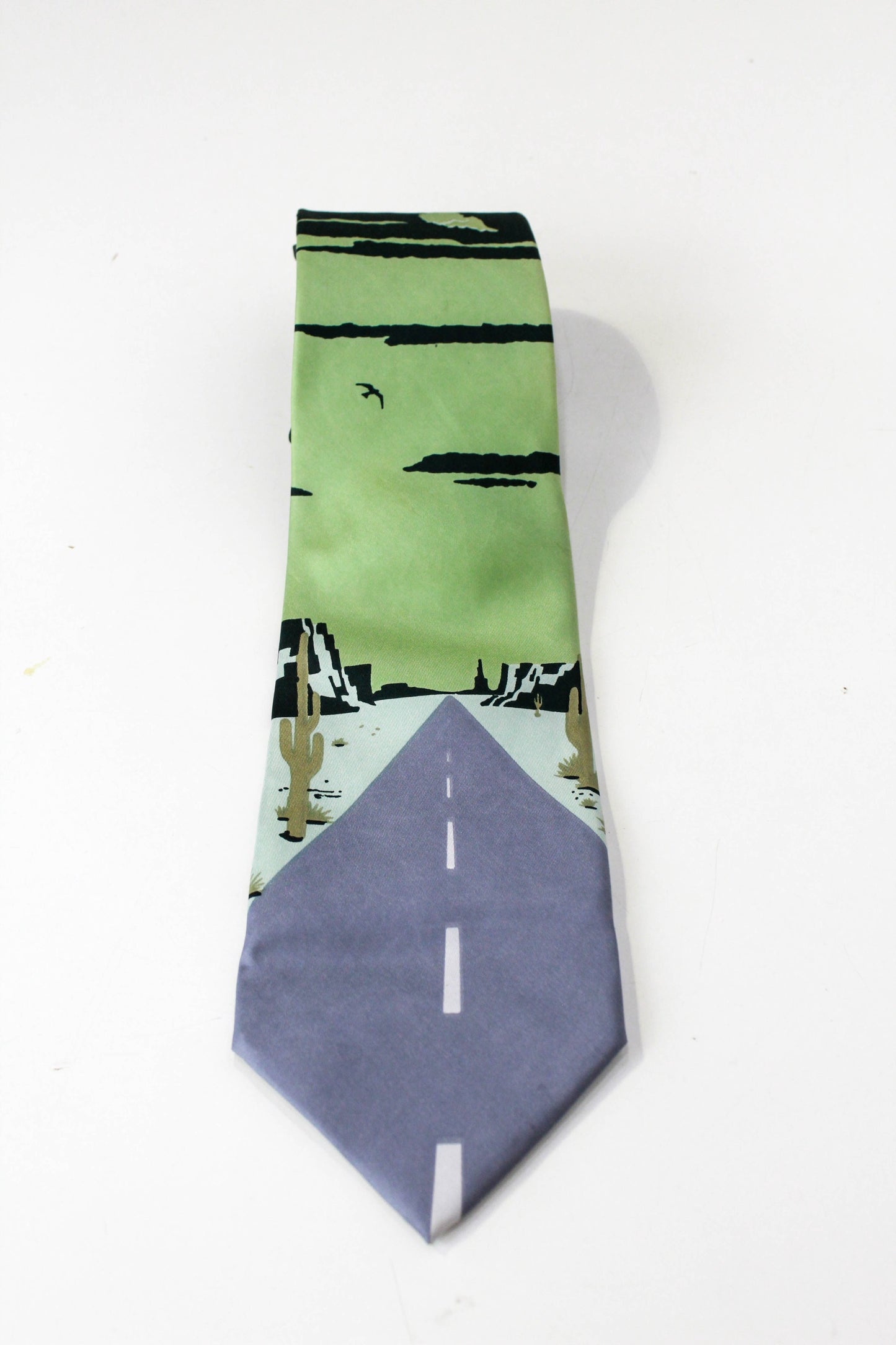 1970s novelty print necktie, silk, desert road with cactus print, by roland