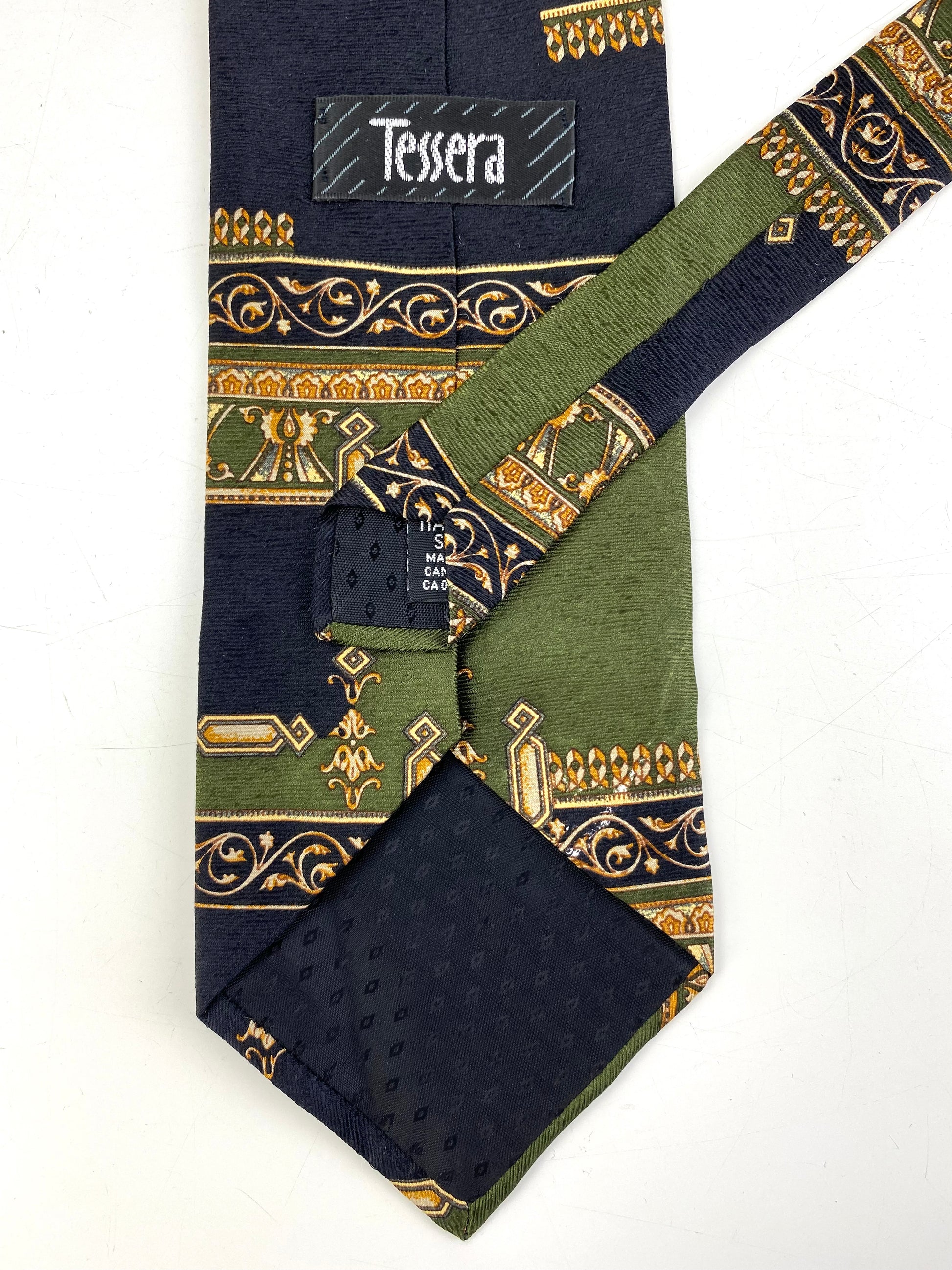 Back and labels of: 90s Deadstock Silk Necktie, Men's Vintage Green/ Navy Filigree Cartouche Pattern Tie, NOS