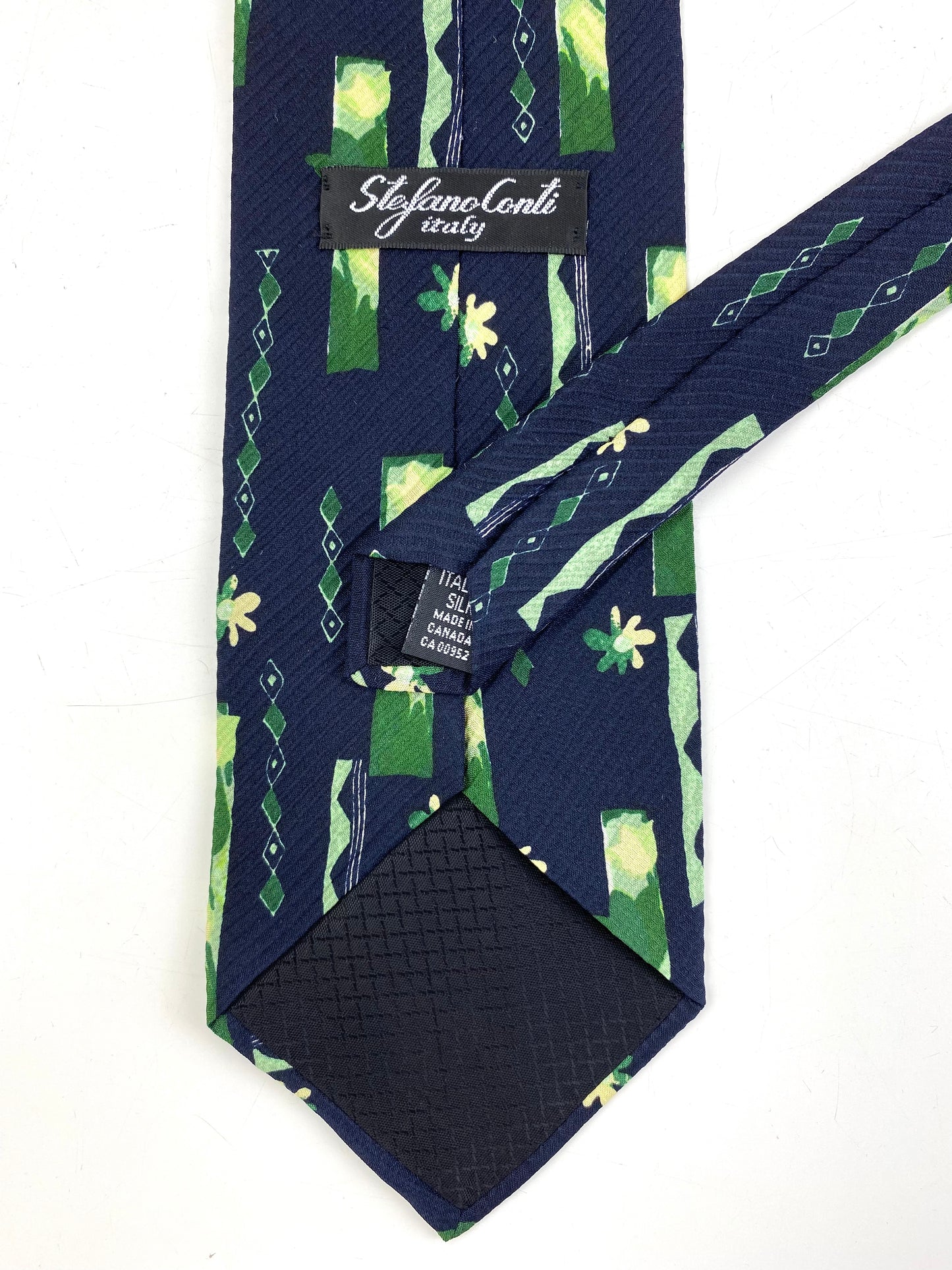 Back and labels of: 90s Deadstock Silk Necktie, Men's Vintage Green/ Navy Floral Pattern Tie, NOS