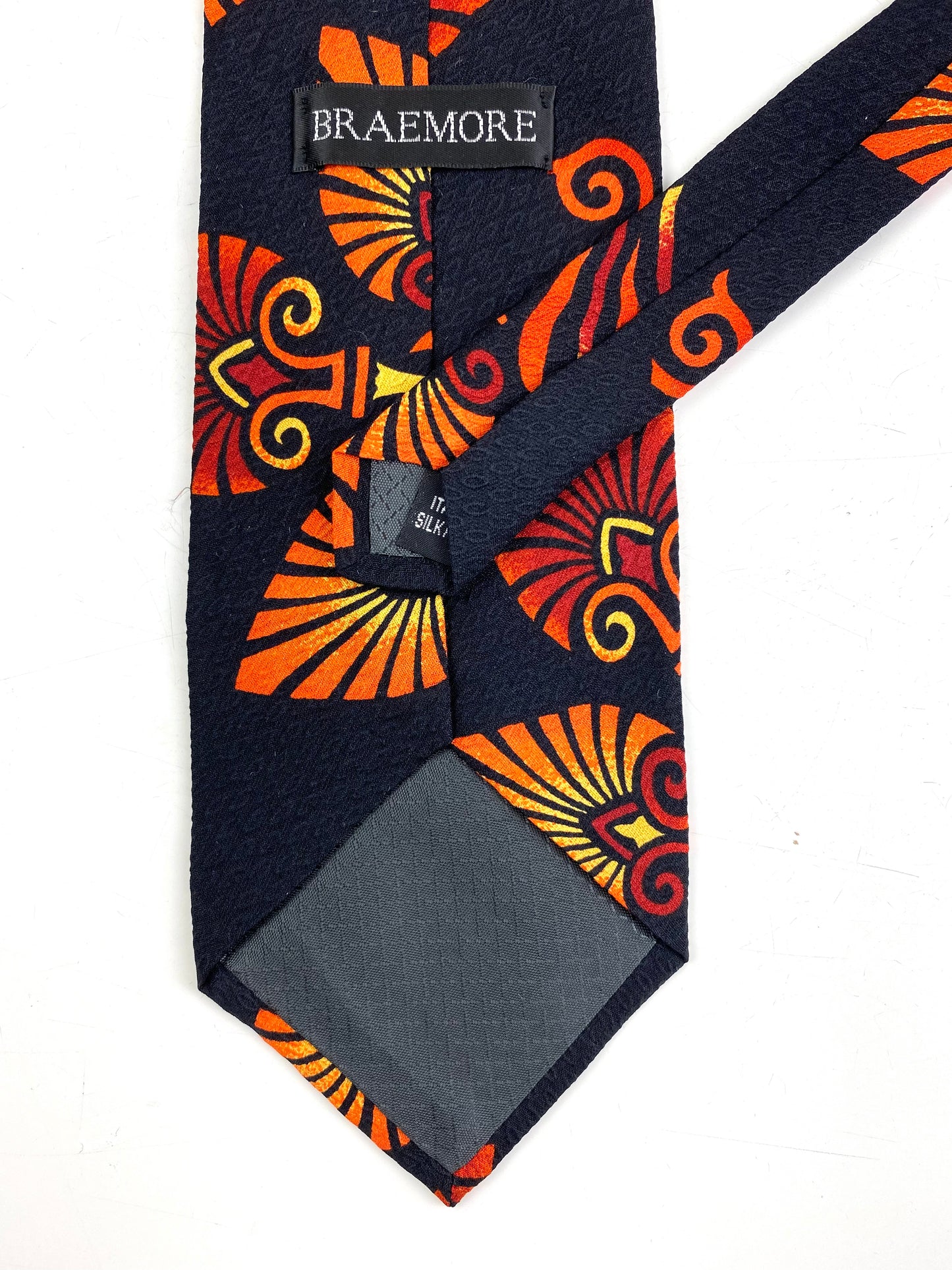 Back and labels of: 90s Deadstock Silk Necktie, Men's Vintage Orange/ Red Tikki Pattern Tie, NOS