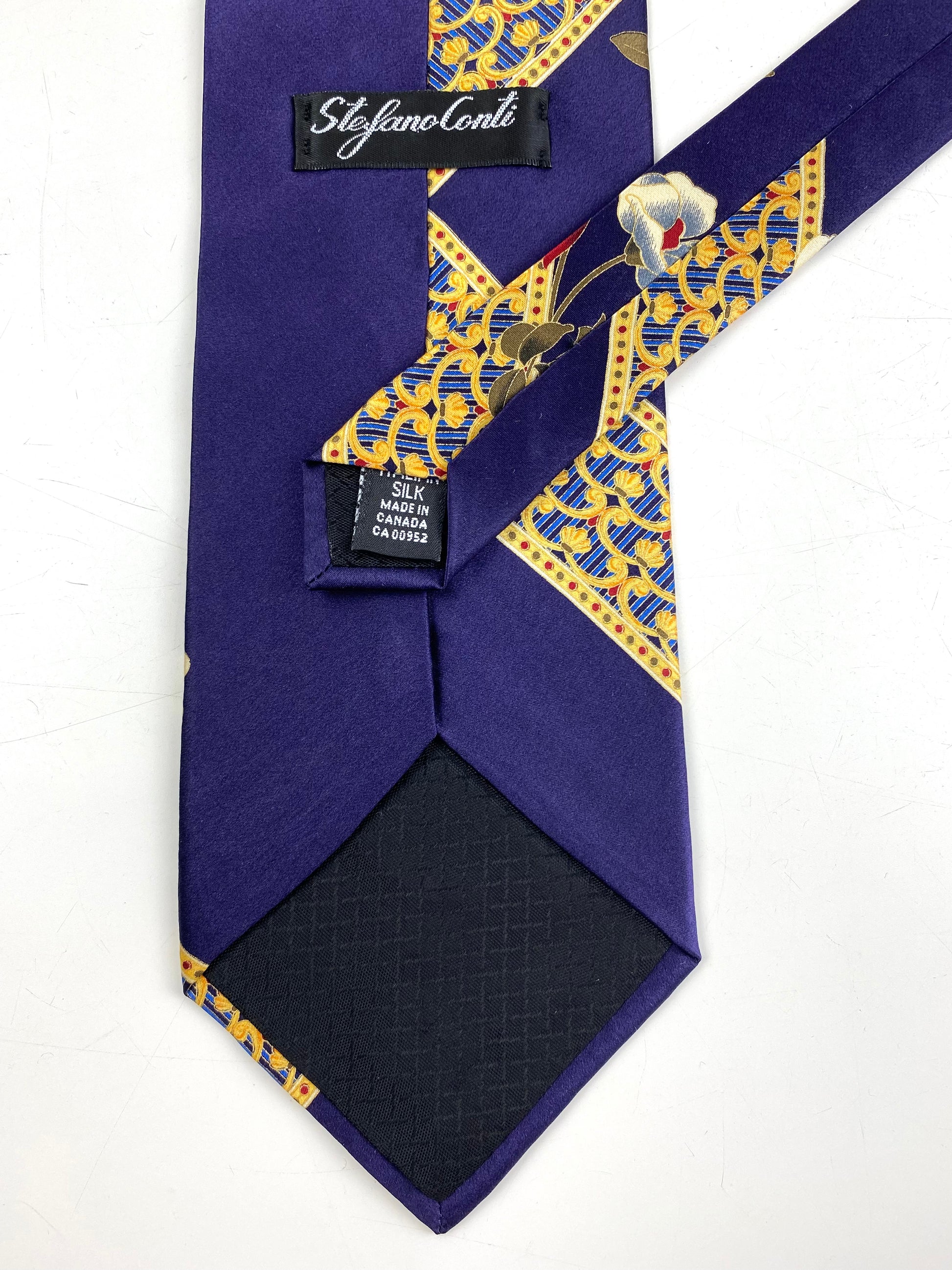 Back and labels of: 90s Deadstock Silk Necktie, Men's Vintage Purple/ Gold Floral Oriental Pattern Tie, NOS