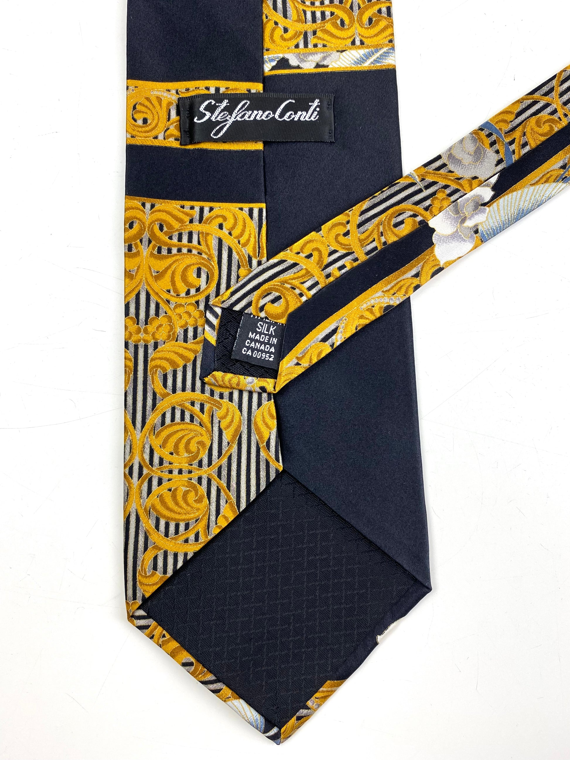 Back and labels of: 90s Deadstock Silk Necktie, Men's Vintage Black/Gold Floral Oriental Pattern Tie, NOS