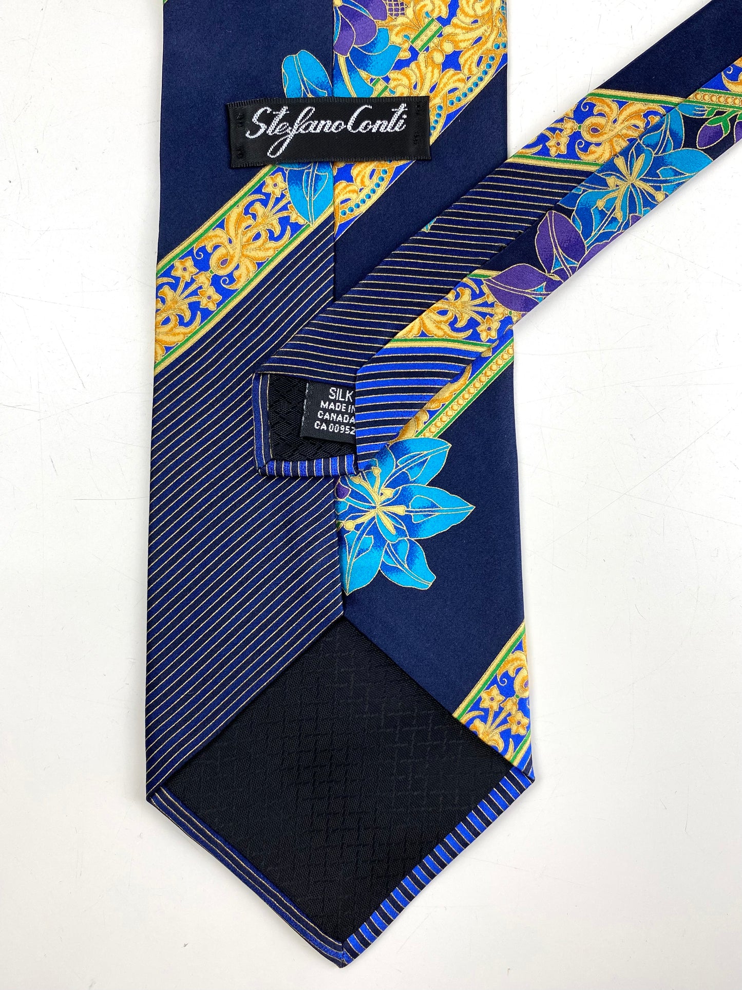 Back and labels of: 90s Deadstock Silk Necktie, Men's Vintage Blue/ Purple Floral Oriental Pattern Tie, NOS