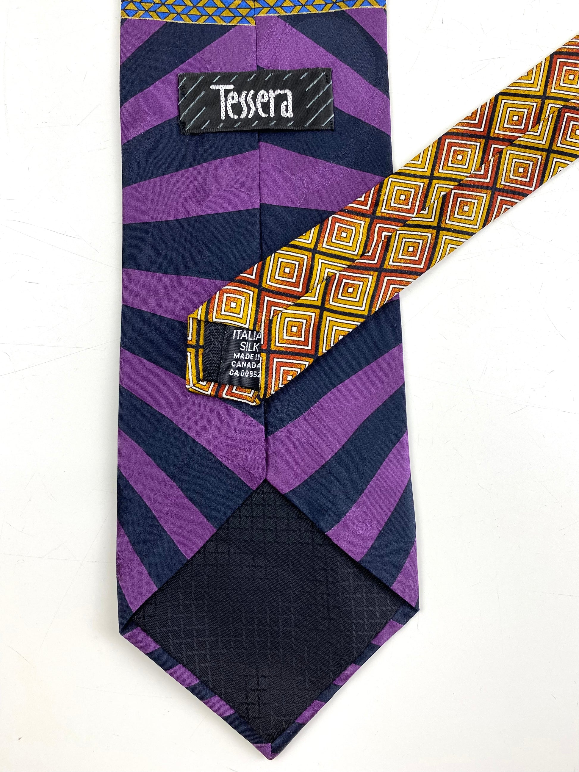 Back and labels of: 90s Deadstock Silk Necktie, Men's Vintage Purple/ Blue Art Deco Print Tie, NOS