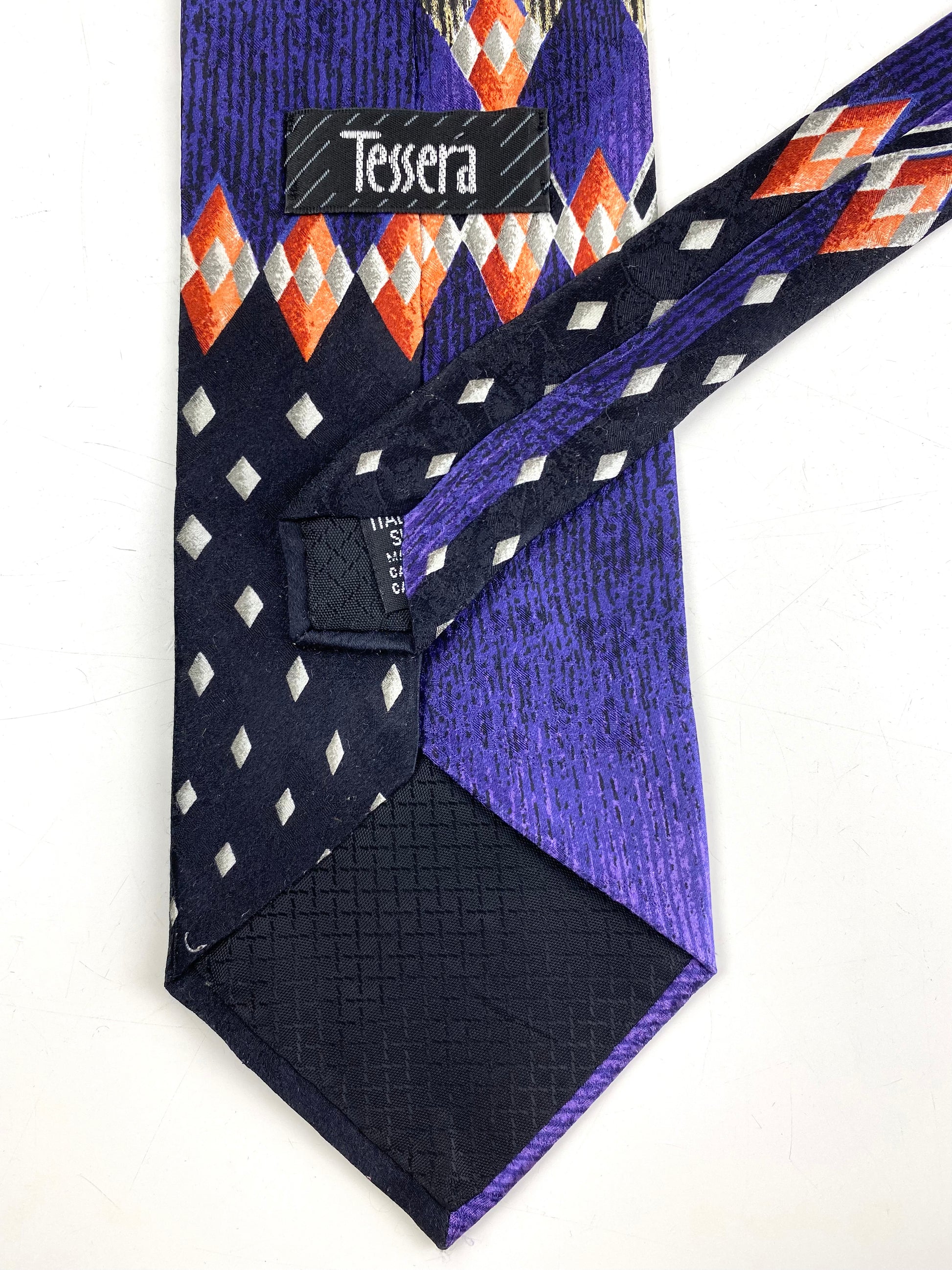 Back and labels of: 90s Deadstock Silk Necktie, Men's Vintage Purple/ Black Geometric Art Deco Pattern Tie, NOS