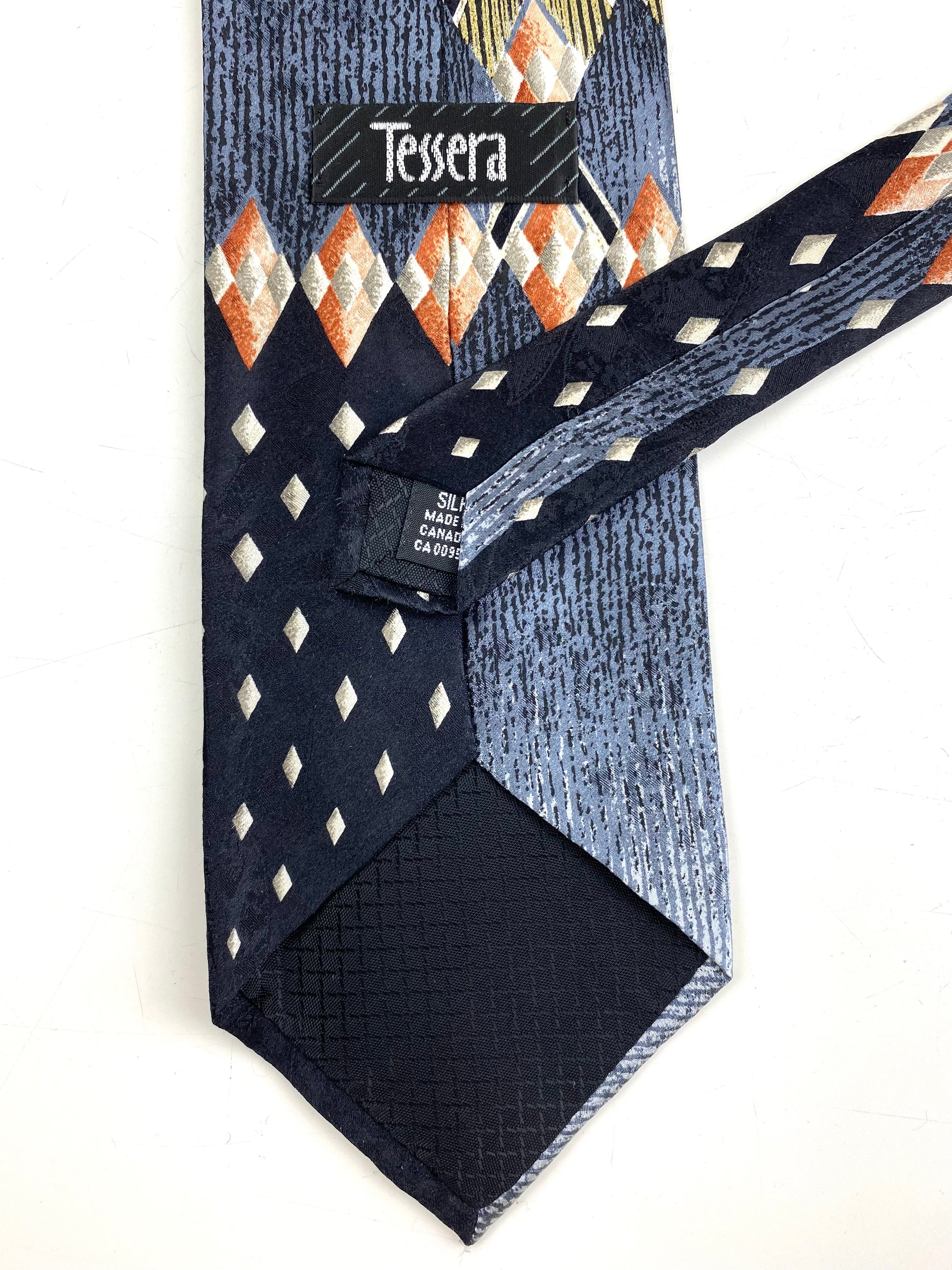 Back and labels of: 90s Deadstock Silk Necktie, Men's Vintage Black/Grey/Rust Geometric Art Deco Pattern Tie, NOS