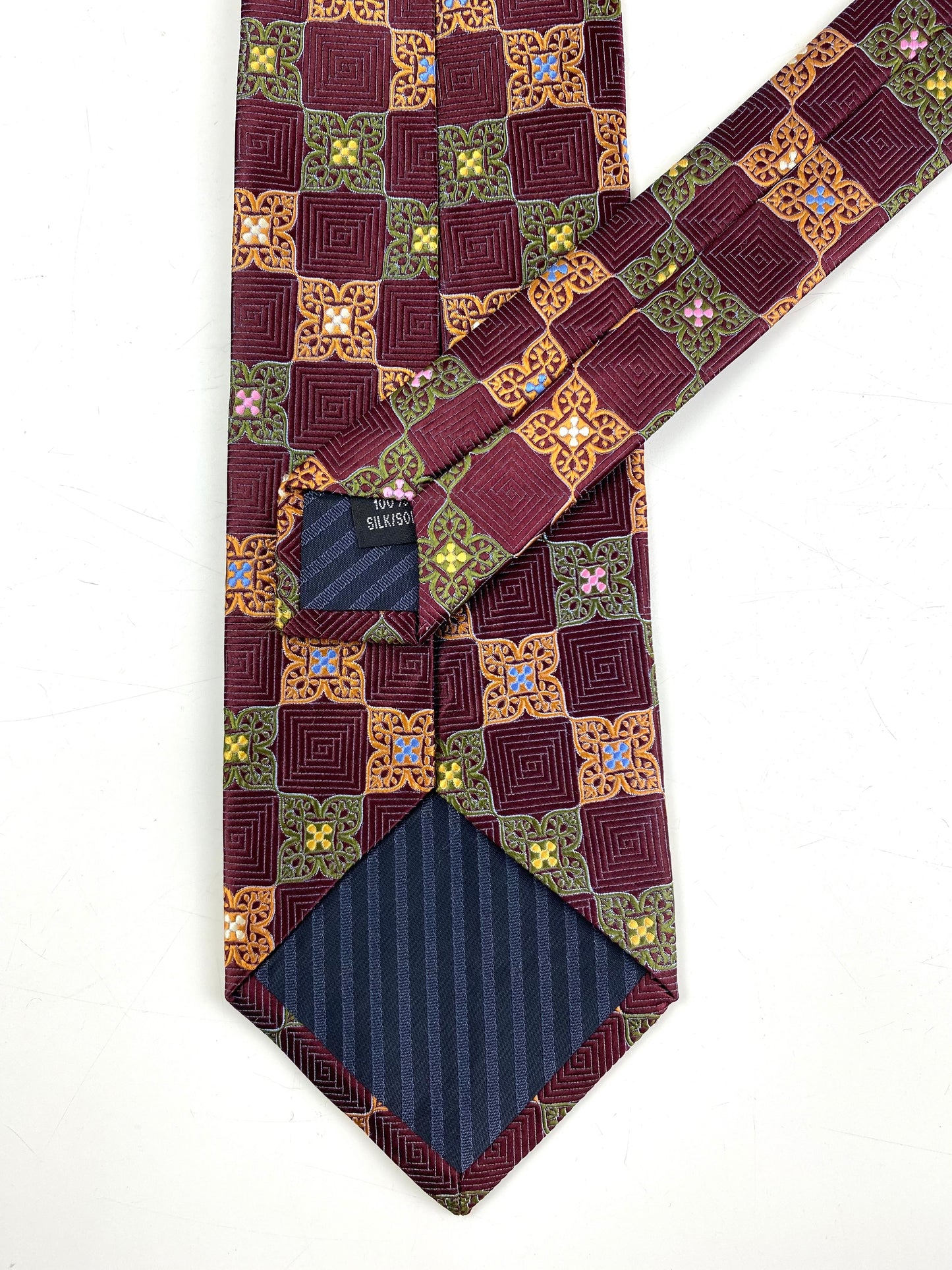 Back and labels of: 90s Deadstock Silk Necktie, Men's Vintage Orange/ Green/ Maroon Moroccan Pattern Tie, NOS