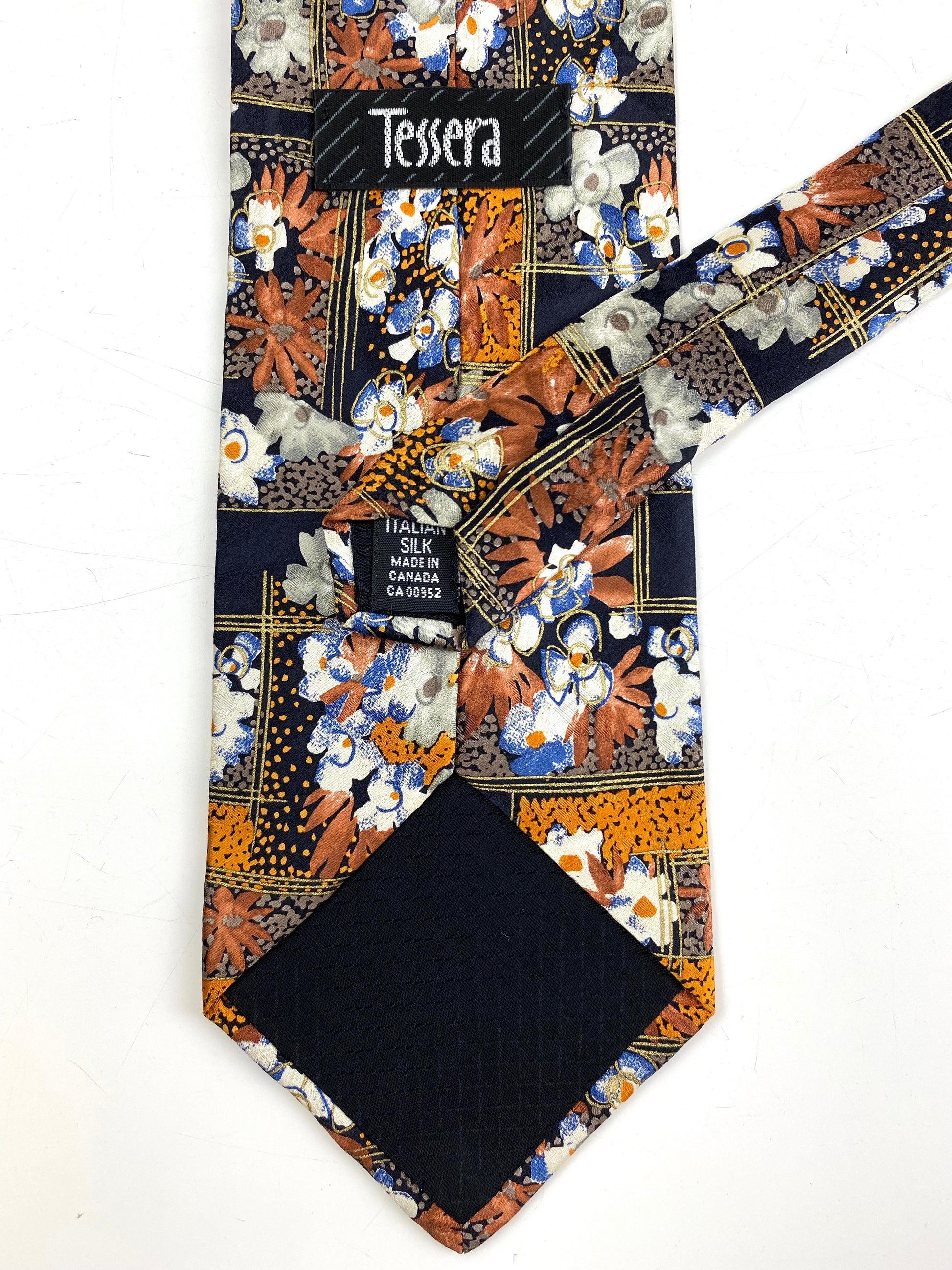 Back and labels of: 90s Deadstock Silk Necktie, Men's Vintage Orange/ Brown Floral Pattern Tie, NOS