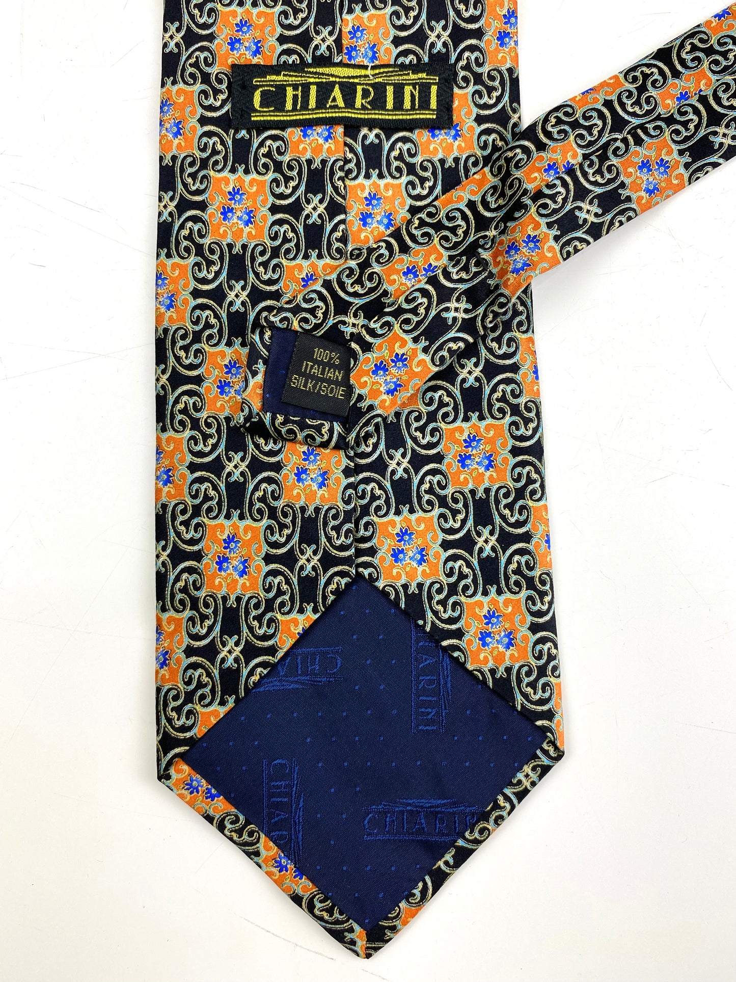 Back and labels of: 90s Deadstock Silk Necktie, Men's Vintage Orange/ Black/ Blue Moroccan Pattern Tie, NOS