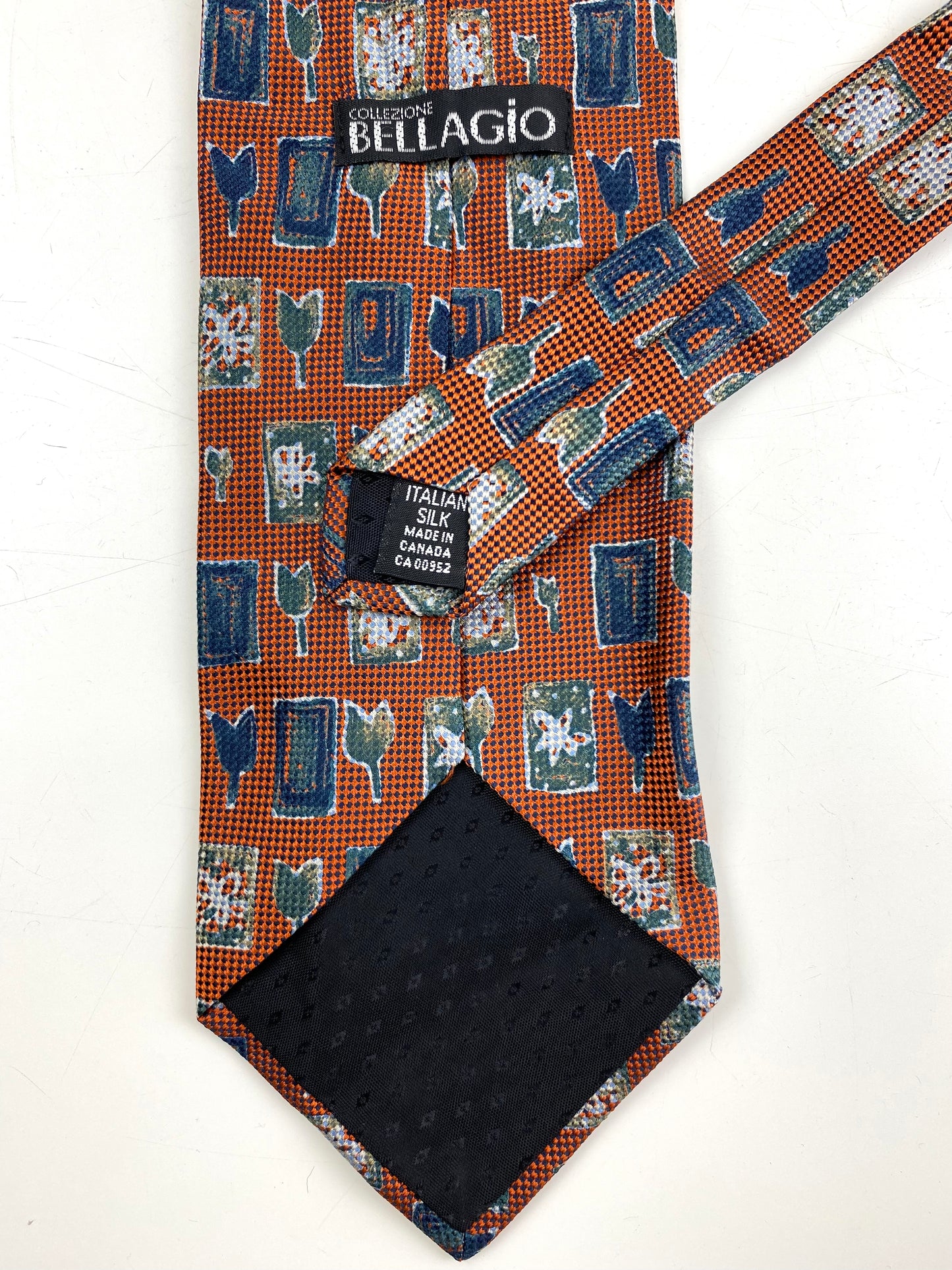 Back and labels of: 90s Deadstock Silk Necktie, Men's Vintage Orange/ Blue/ Green Tulip Rectangle Pattern Tie, NOS