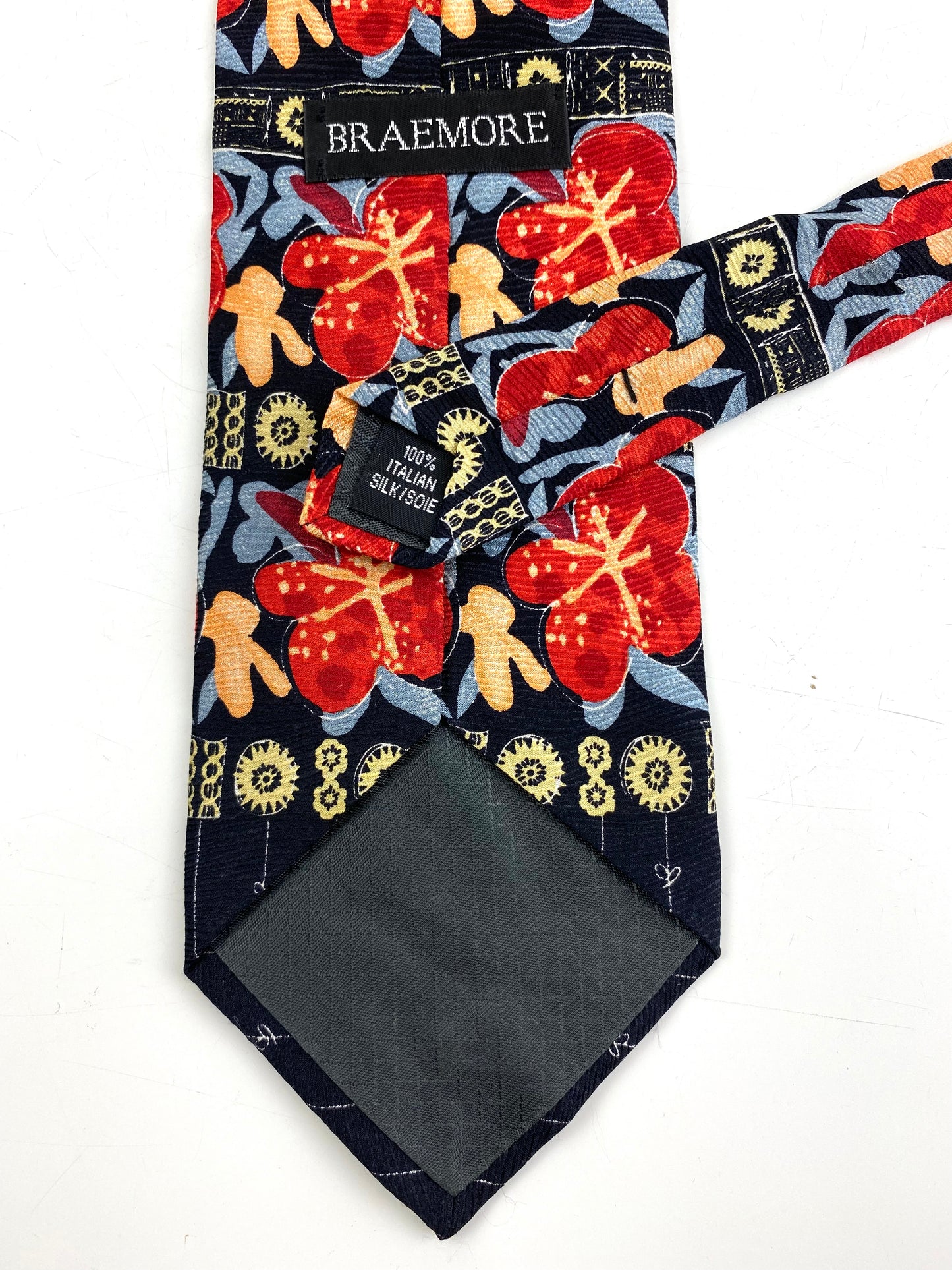 Back and labels of: 90s Deadstock Silk Necktie, Men's Vintage Blue/ Orange/ Red Abstract Pattern Tie, NOS