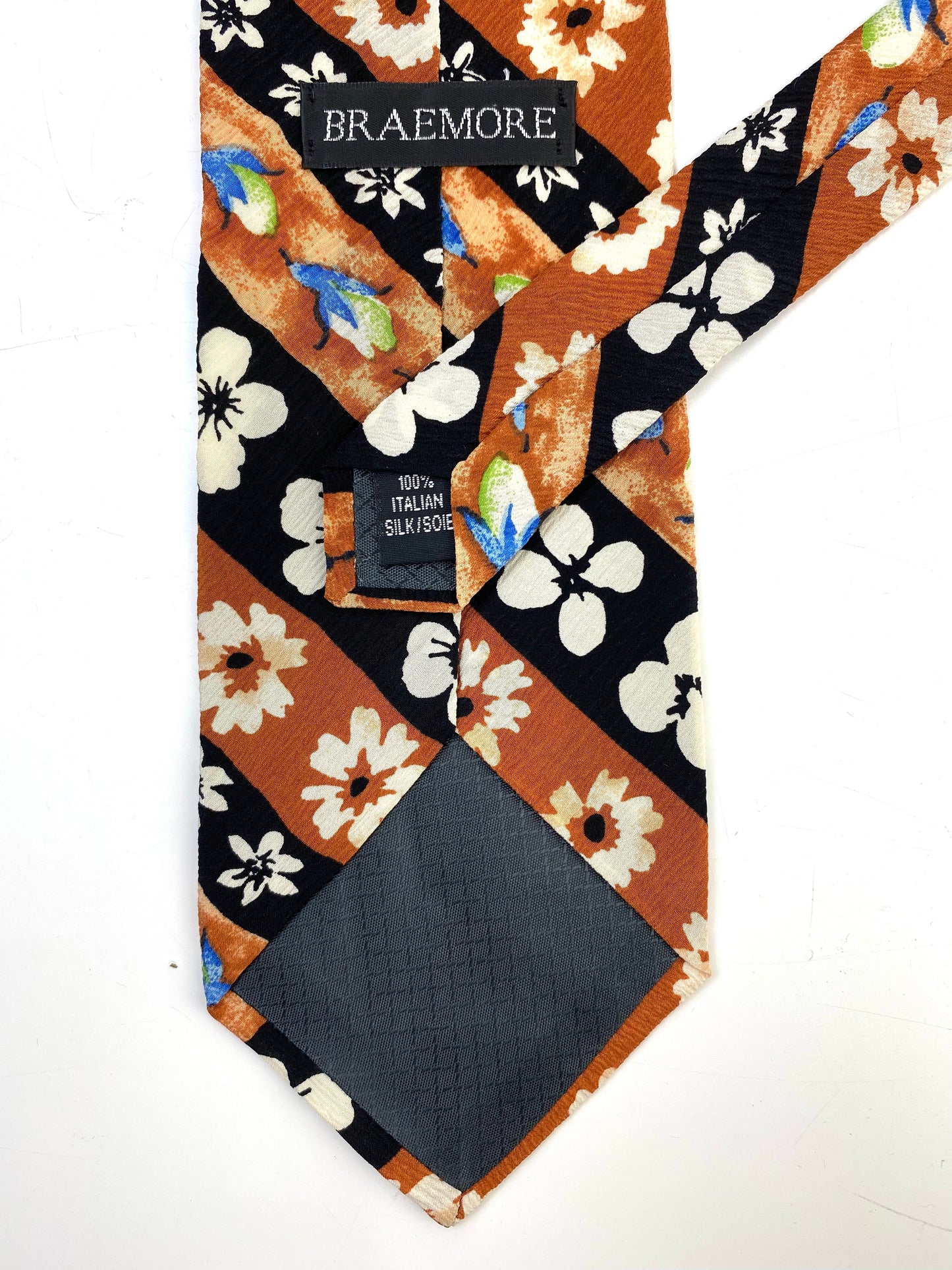Back and labels of: 90s Deadstock Silk Necktie, Men's Vintage Brown/ Black Diagonal Stripe Floral Pattern Tie, NOS