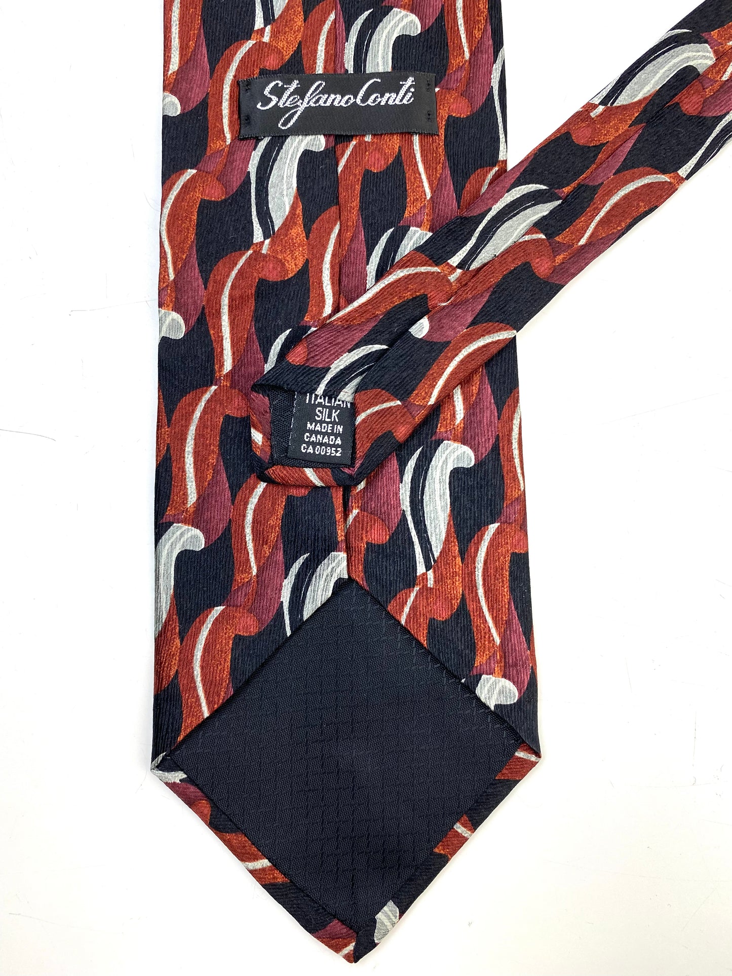 Back and labels of: 90s Deadstock Silk Necktie, Men's Vintage Black/ Brown/ Grey Abstract Pattern Tie, NOS