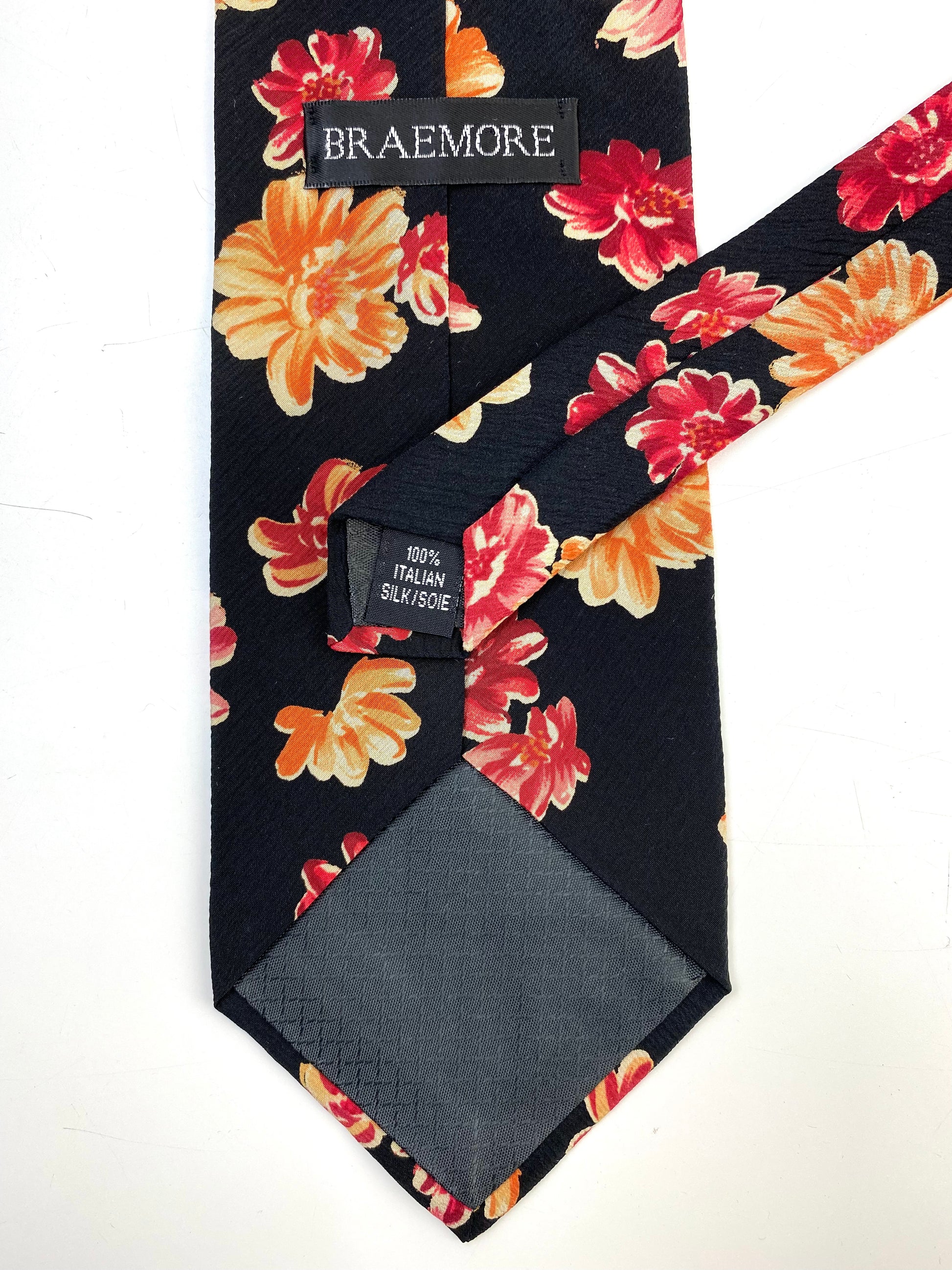 Back and labels of: 90s Deadstock Silk Necktie, Men's Vintage Black/ Orange/ Pink Floral Pattern Tie, NOS