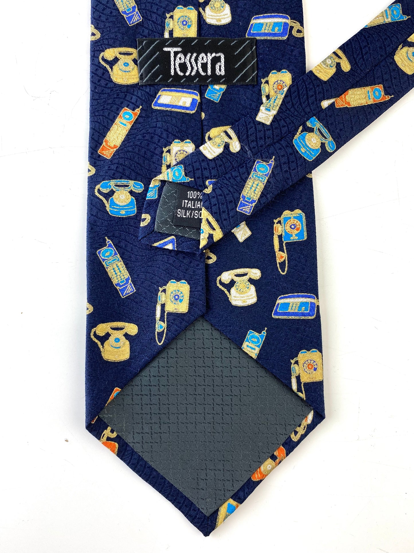 Back and labels of: 90s Deadstock Silk Necktie, Men's Vintage Navy Metallic Novelty Telephone Print Tie, NOS