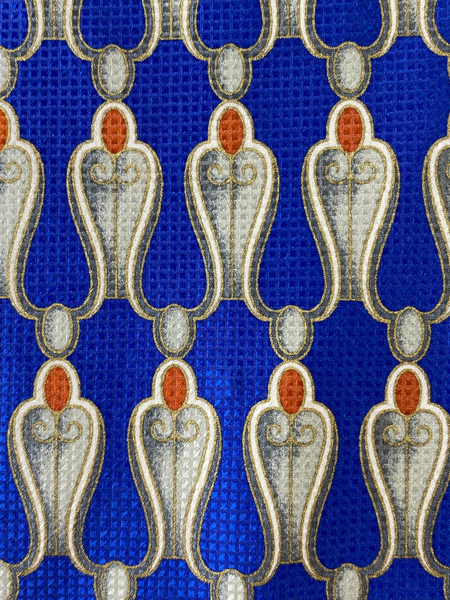Close-up pattern detail of: 90s Deadstock Silk Necktie, Men's Vintage Blue/Silver/Gold Pattern Tie, NOS