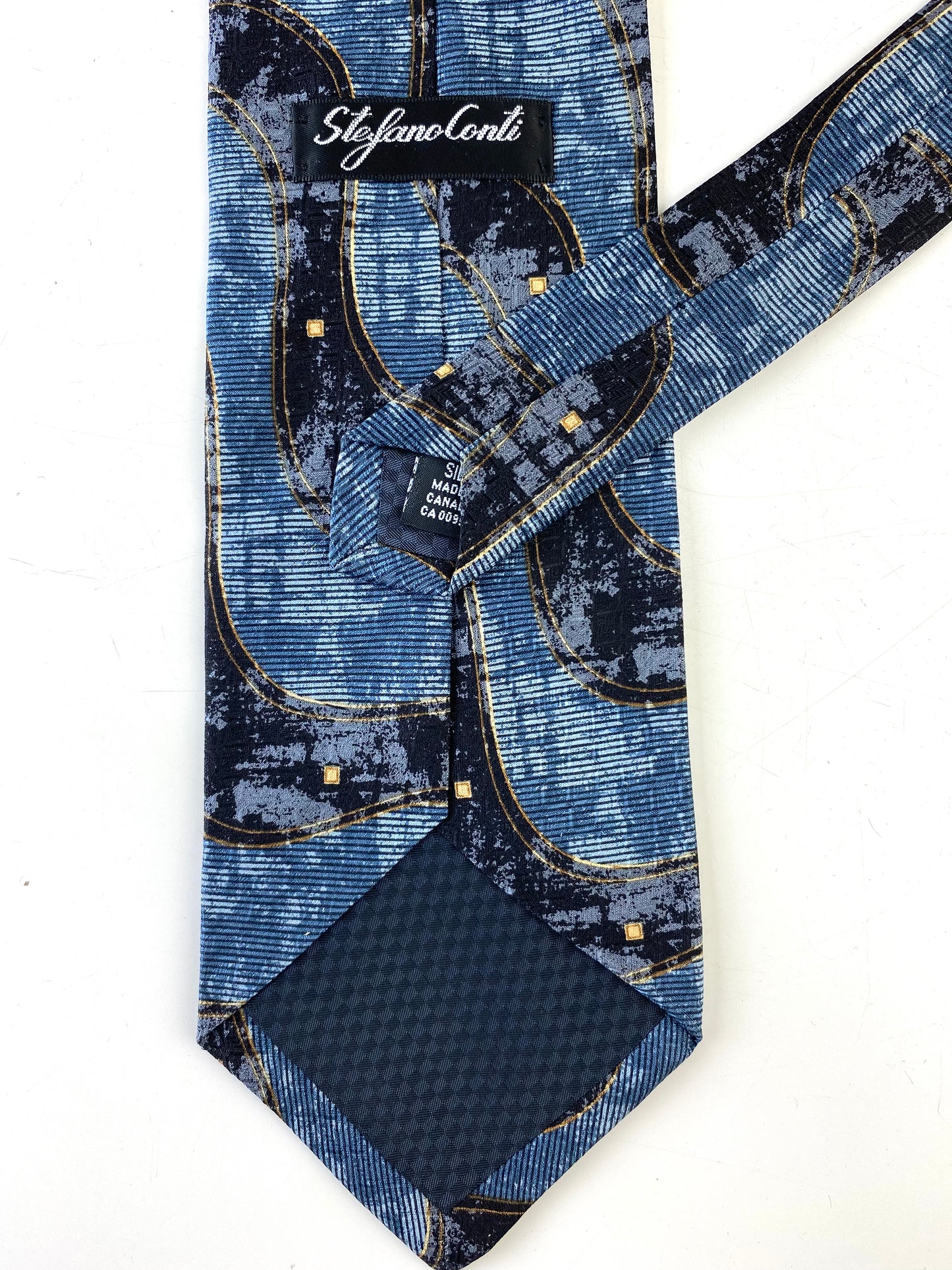 Back and labels of: 90s Deadstock Silk Necktie, Men's Vintage Blue Purple Wave Pattern, NOS