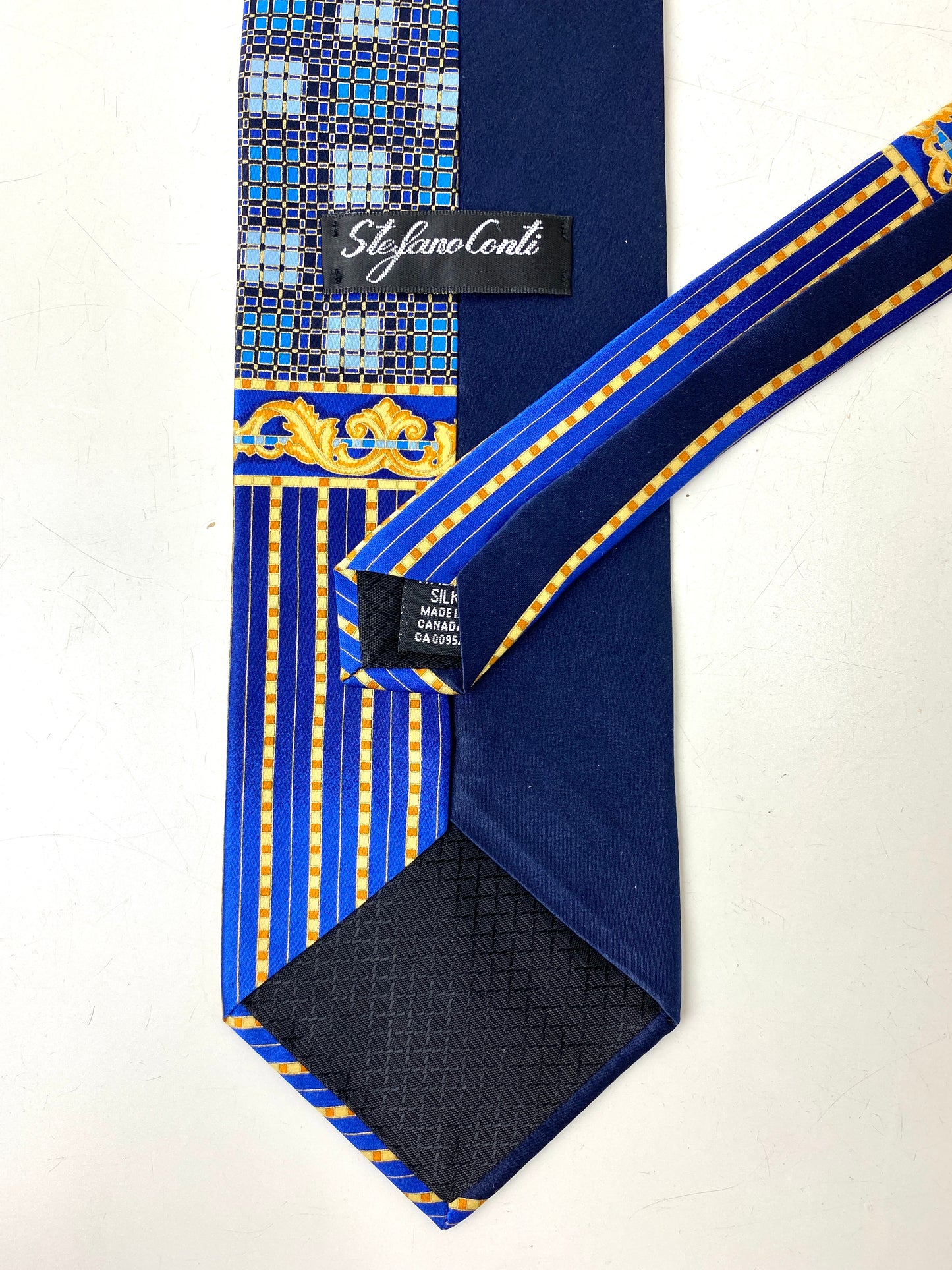 Back and labels of: 90s Deadstock Silk Necktie, Men's Vintage Navy/ Blue/ Gold Art Nouveau Print Tie, NOS