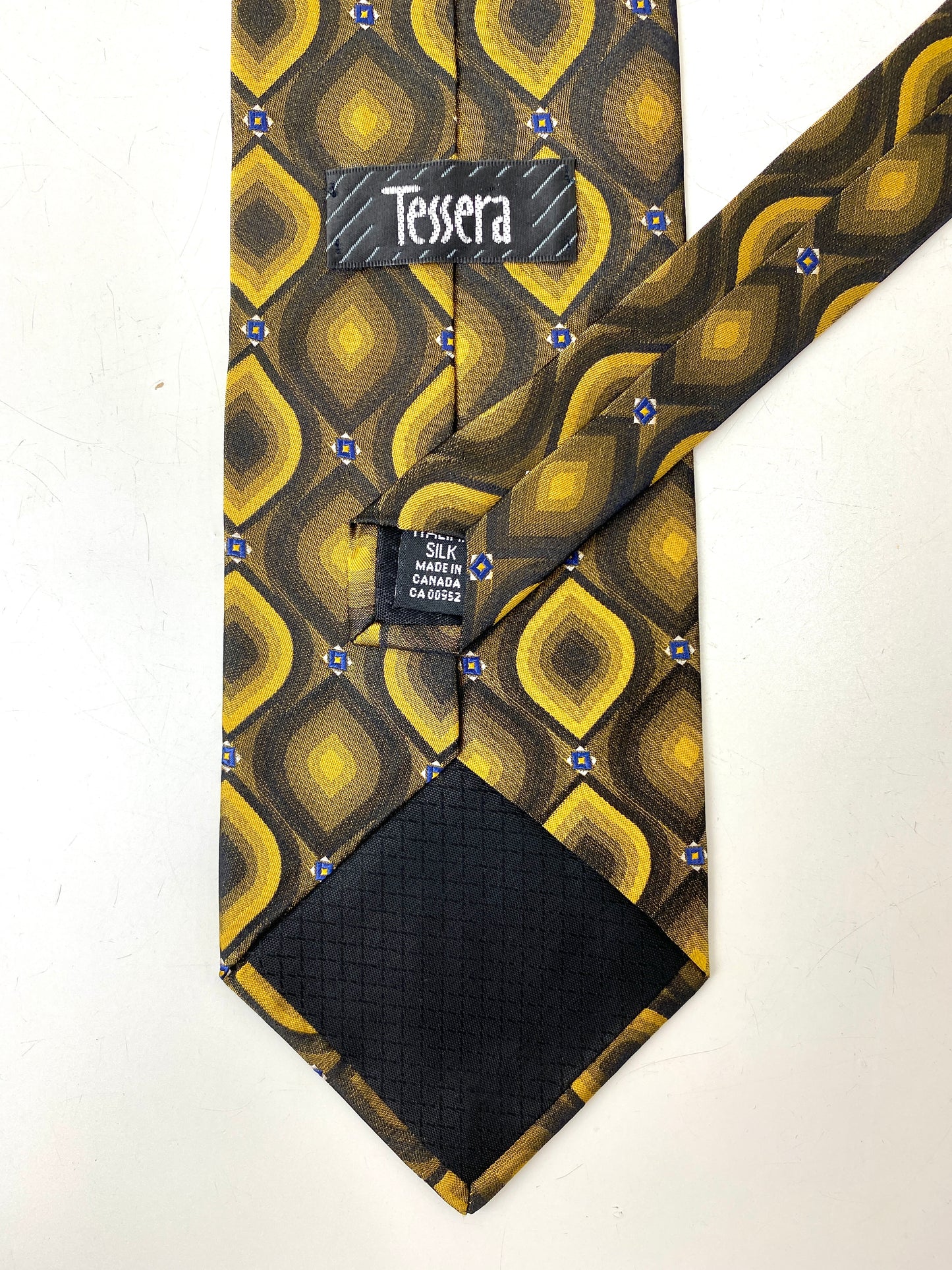 Back and labels of: 90s Deadstock Silk Necktie, Men's Vintage Gold Ogee Pattern Tie, NOS