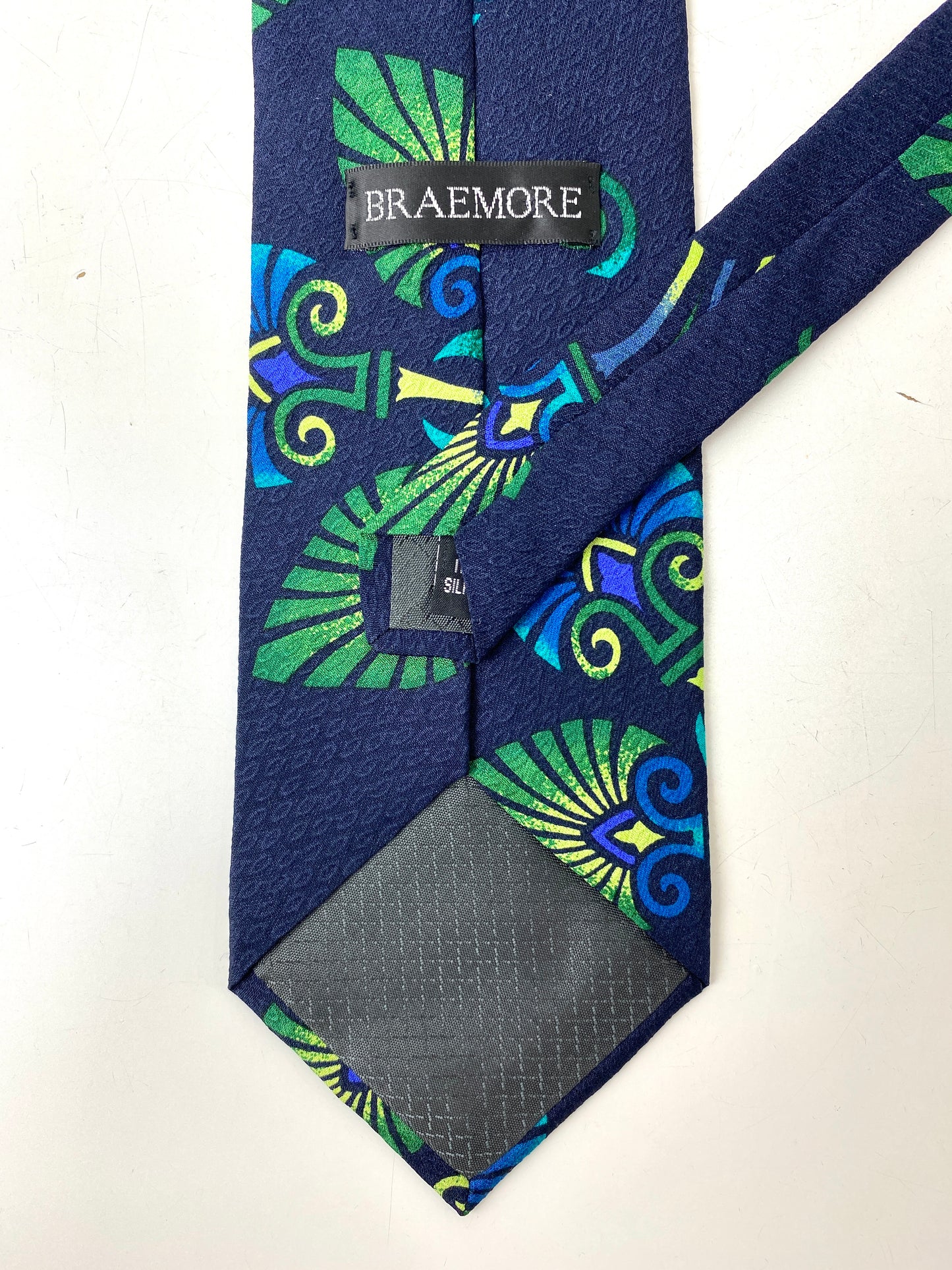 Back and labels of: 90s Deadstock Silk Necktie, Men's Vintage Blue/ Green Tikki Pattern Tie, NOS