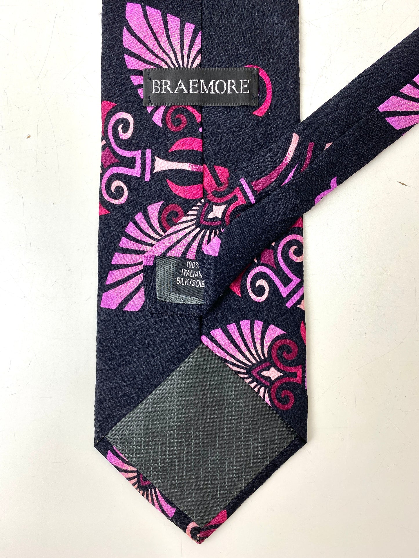 Back and labels of: 90s Deadstock Silk Necktie, Men's Vintage Pink Tikki Pattern Tie, NOS